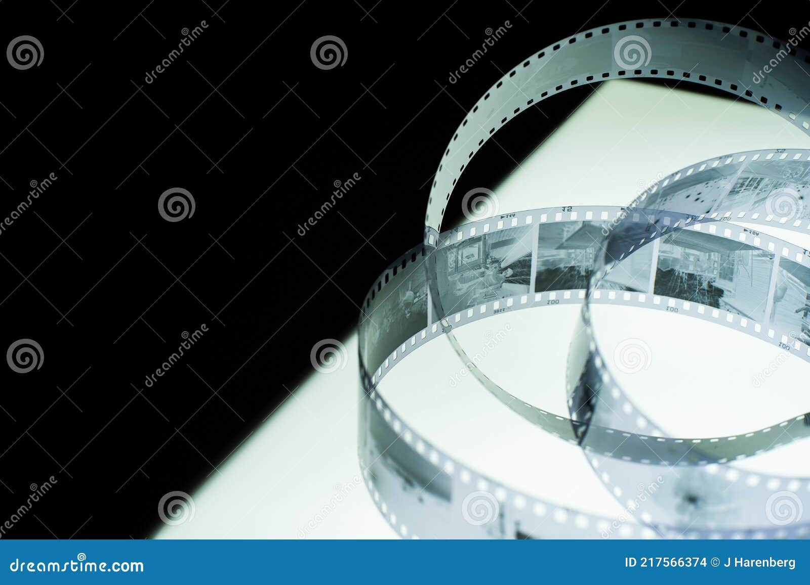 Film Strip on Lightbox, Oblique View with Copy Space Stock Photo