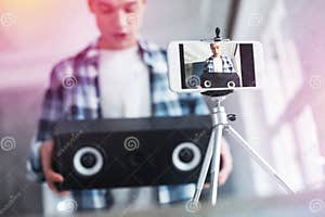 Handsome Student Filming Video About Birthday Presents Using Photo 