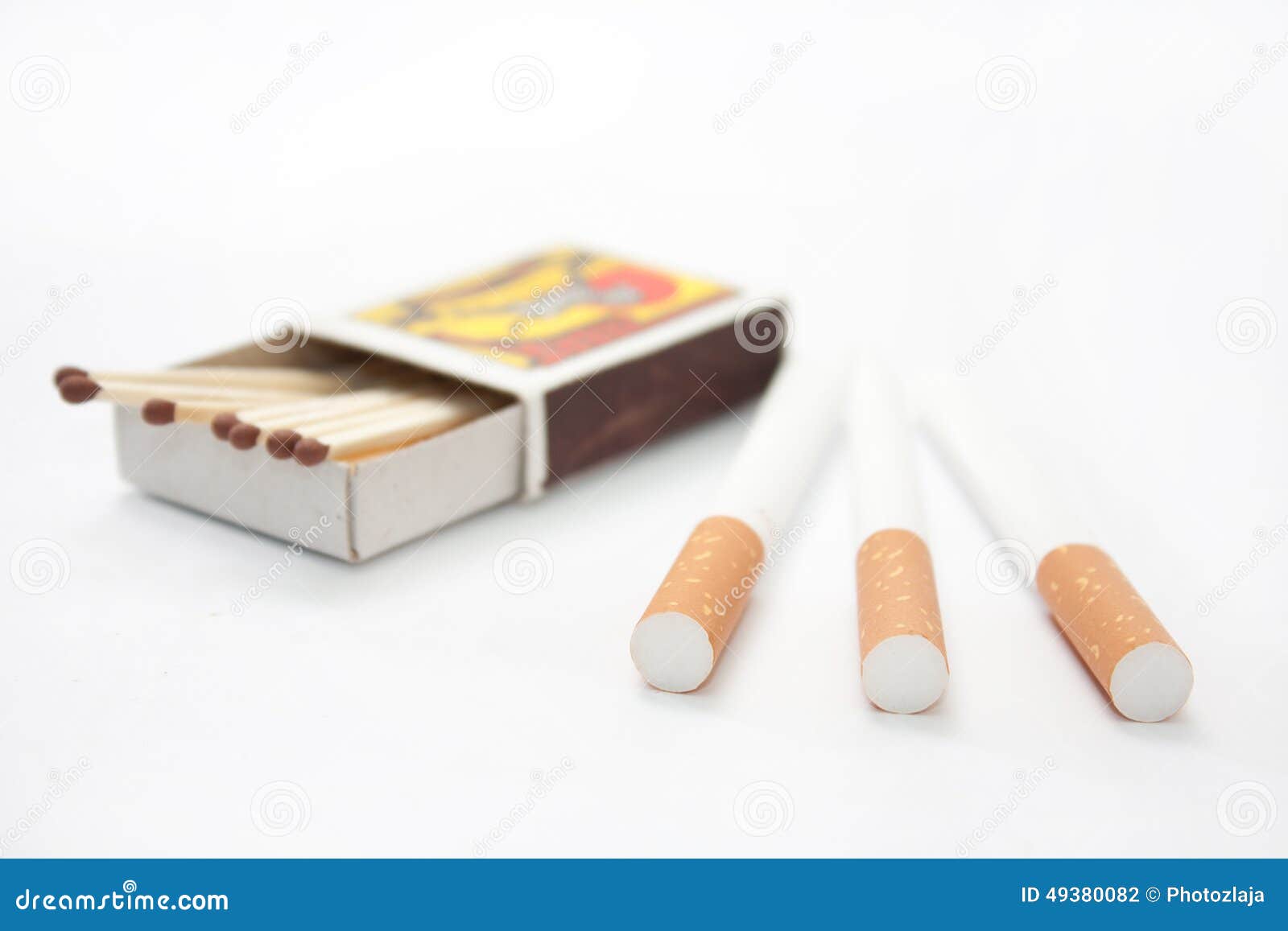 Filter Cigarettes with Box of Matches in the Background Stock Photo