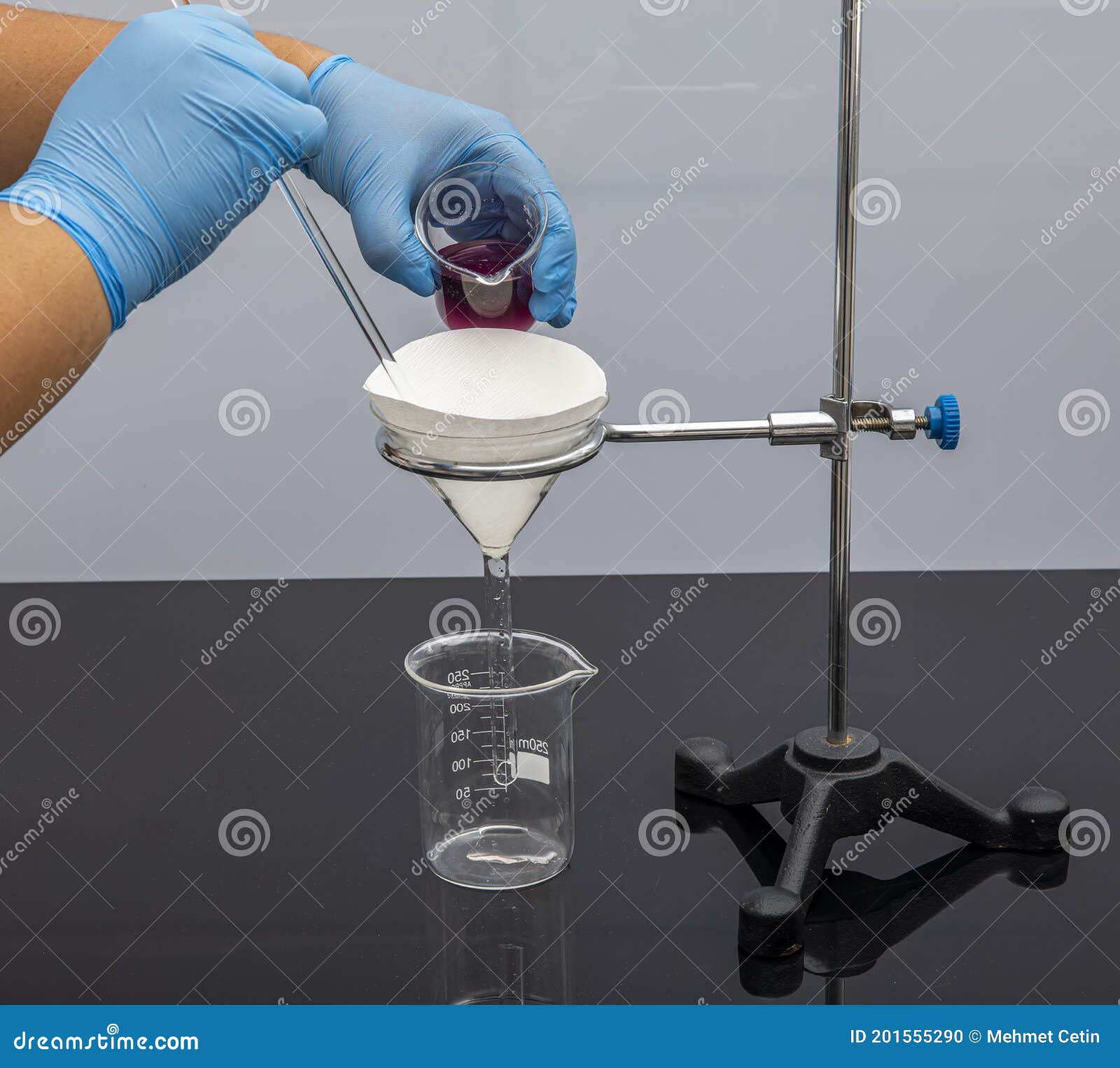 filter paper in laboratory. scientists are chemical filtration by filtering through filter paper in a glass funnel, close up. phar