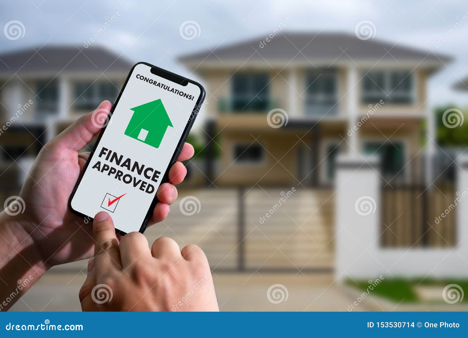 finance loan agreement and house key mortgage loan approval on mobile phone in a house