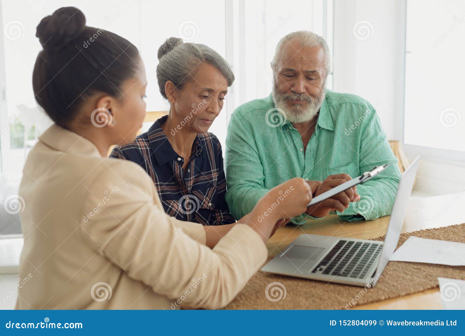 financial adviser discussing information with a couple
