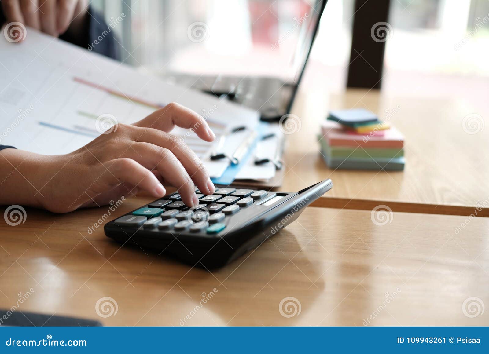 Financial Adviser Working with Calculator & Computer at Office. Stock