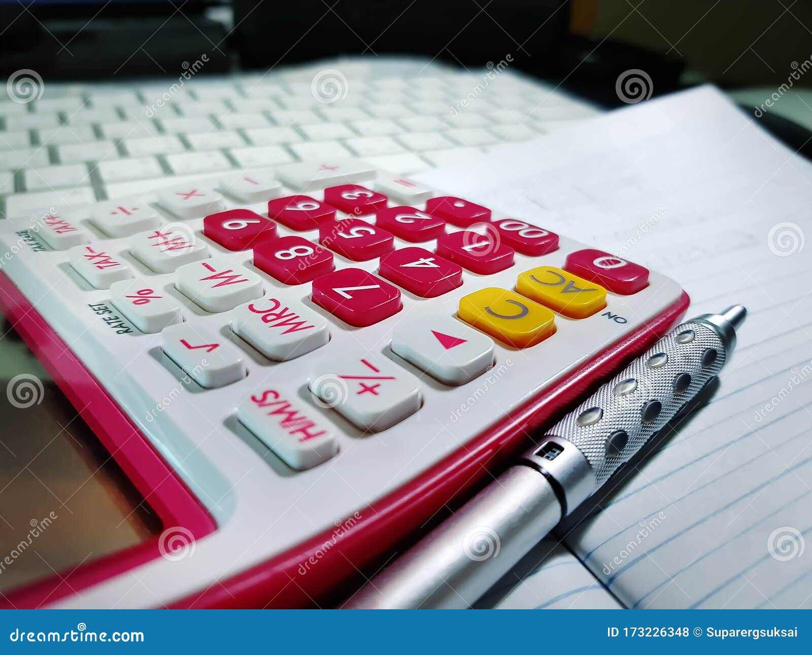 Financial Calculator and Mechanical Pencil on Working Table Stock Photo