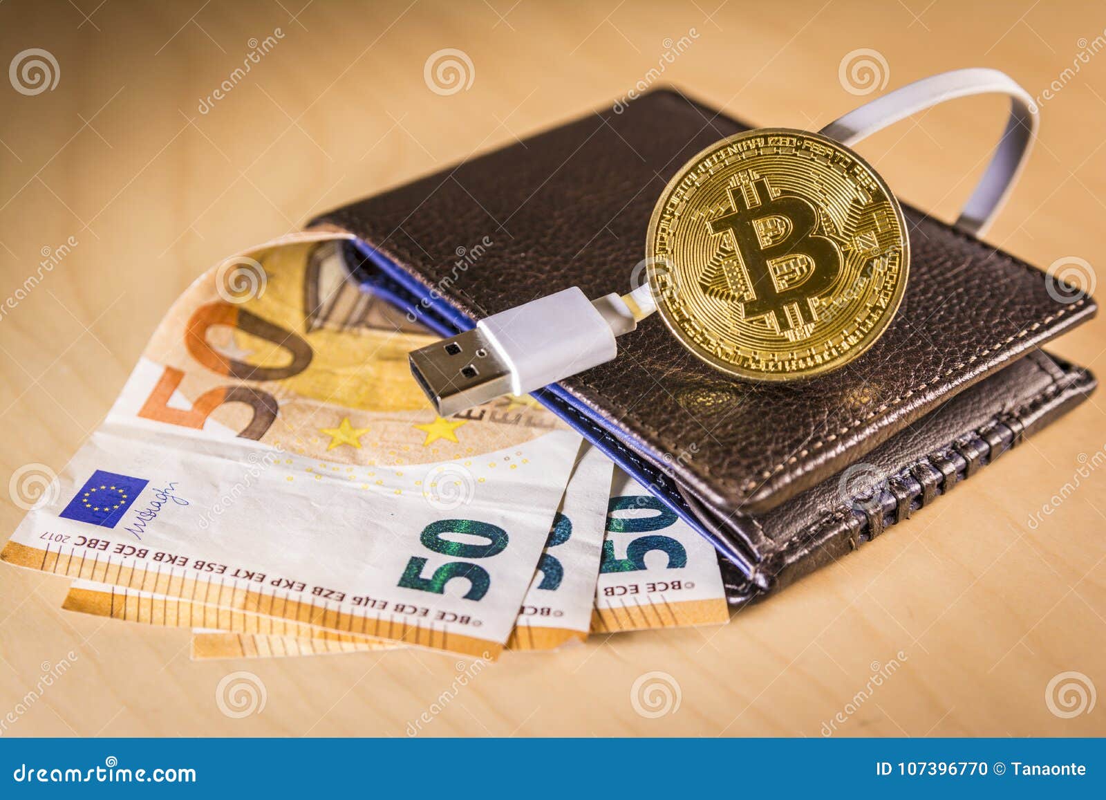 Financial Concept With Golden Bitcoin Over A Wallet With Euro Bills And USB Cable Stock Photo ...