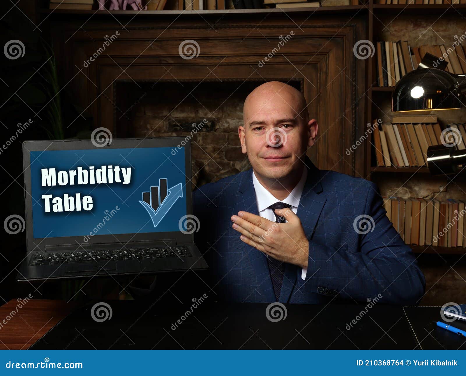 financial concept meaning morbidity table with sign on laptop