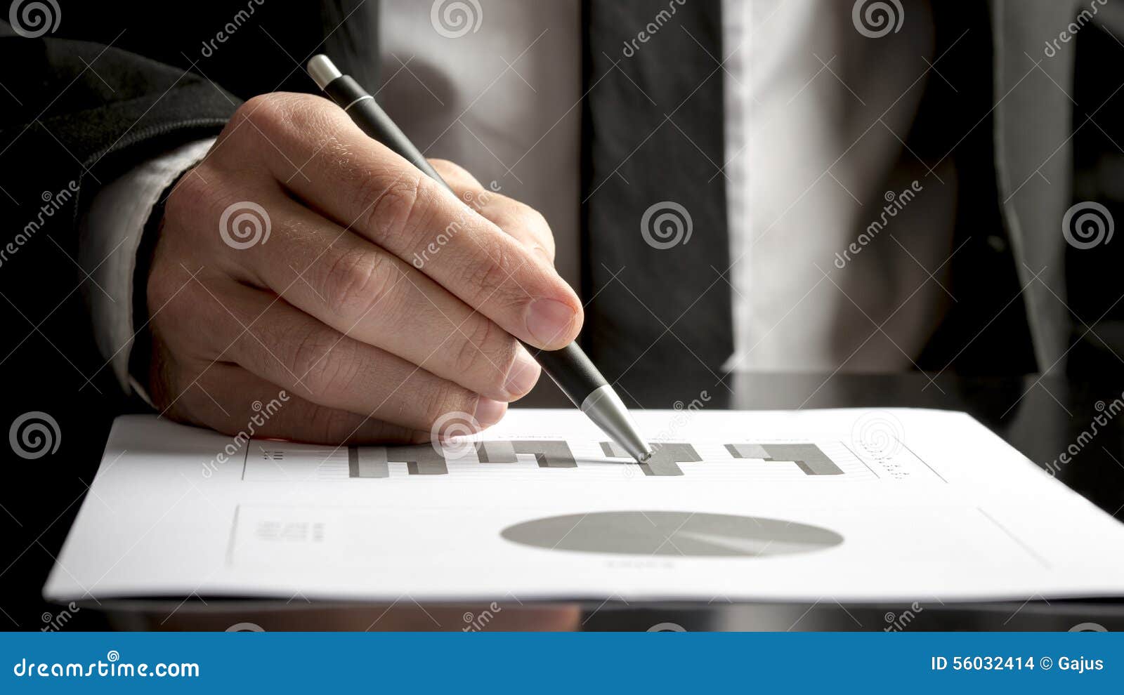 financial consultant reviewing statistical graphs and charts