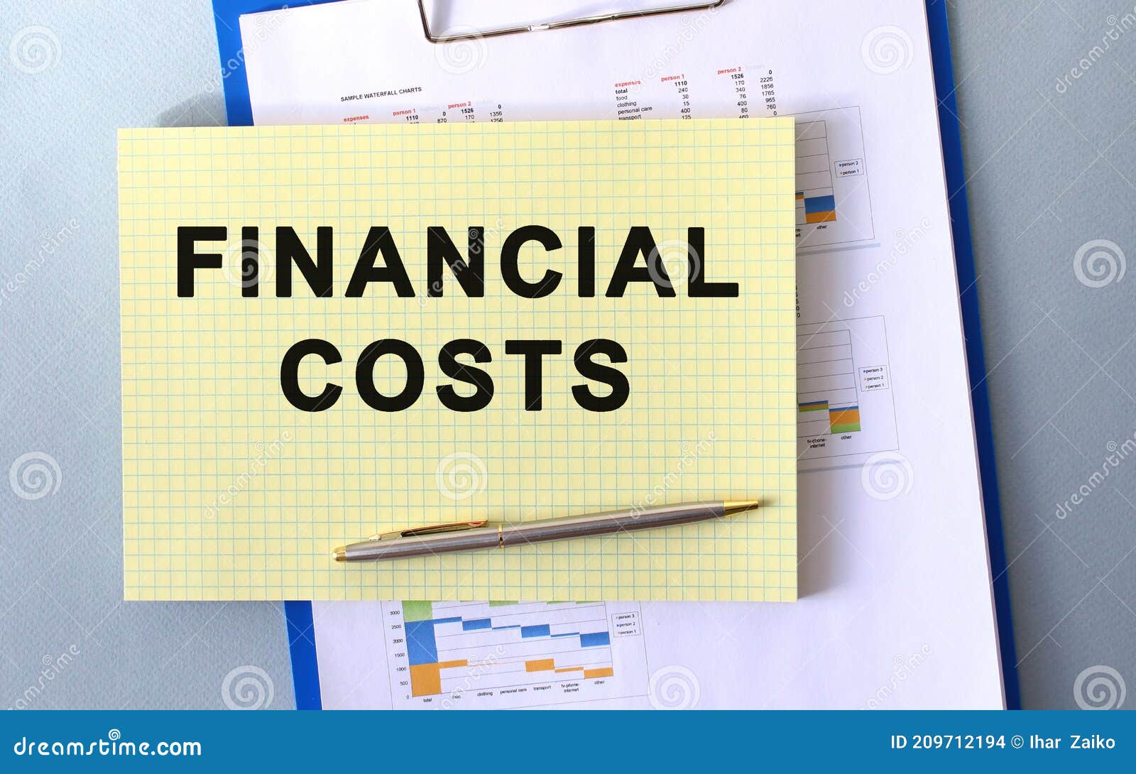 FINANCIAL COSTS Text Written on Notepad with Pencil. Notepad on a