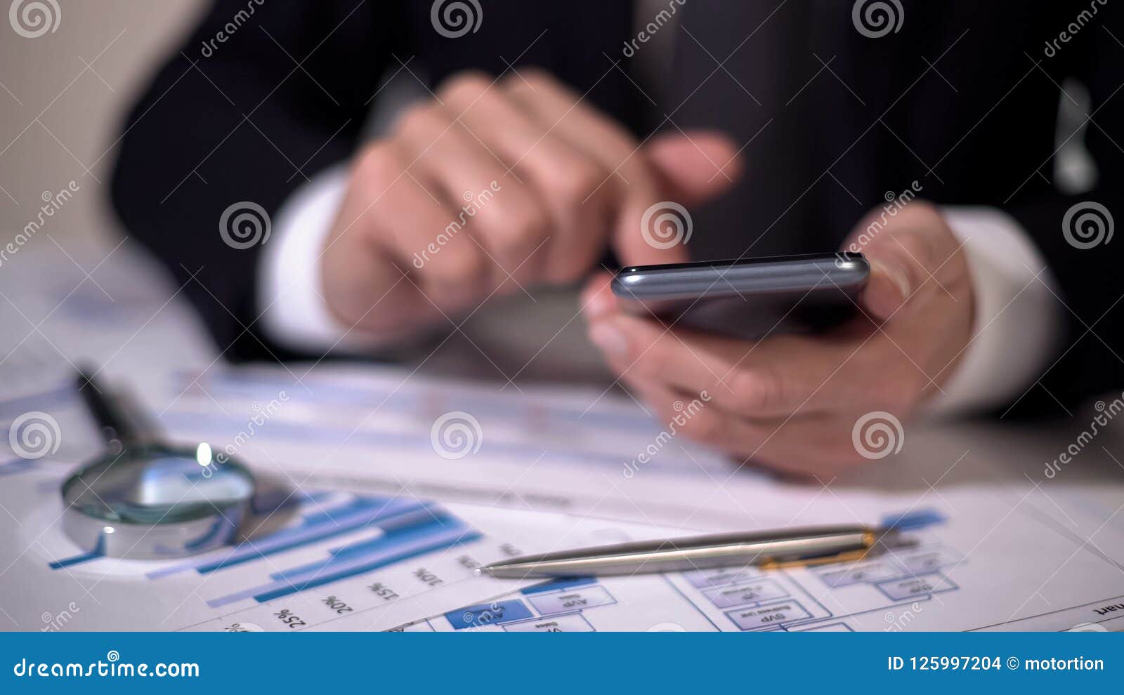 financial expert making calculations on gadget, studying statistics in diagrams