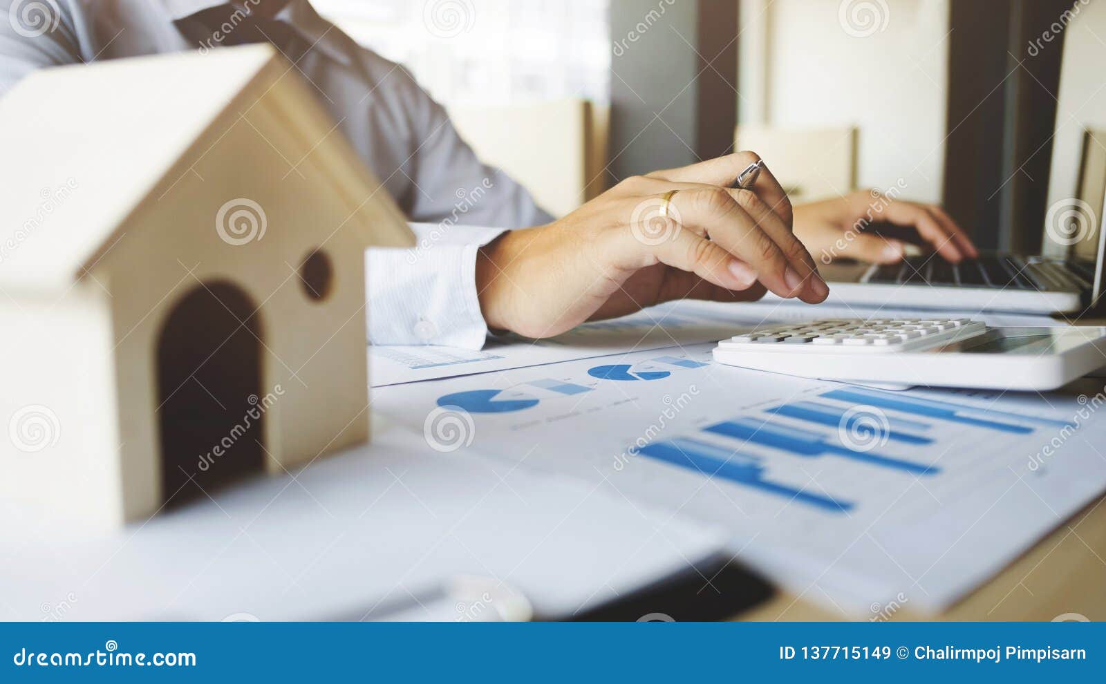 financial inspector making report,insurance agent analyzing about home investment loan at office room