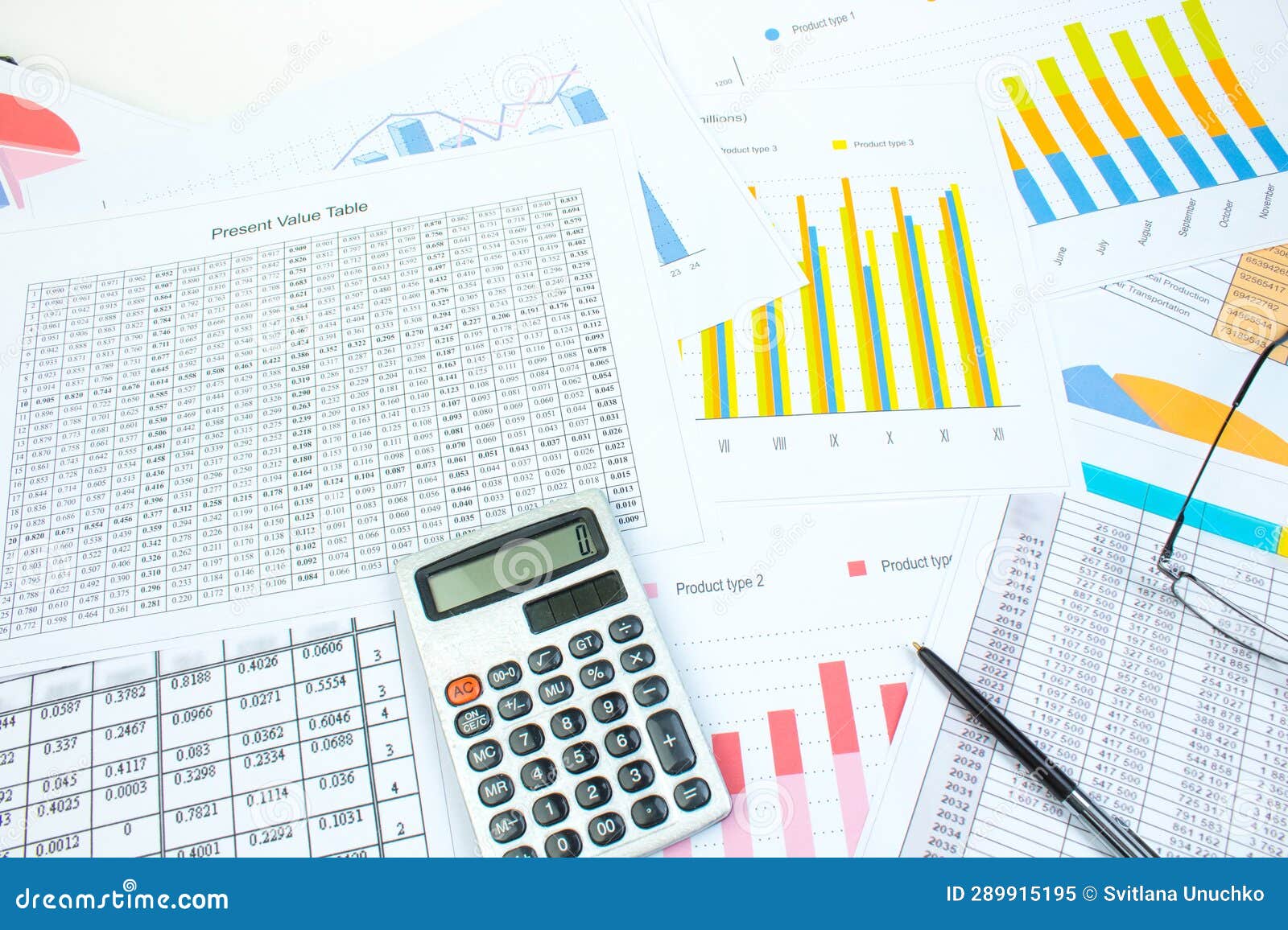 financial printed paper charts, graphs and diagrams on the table. top view