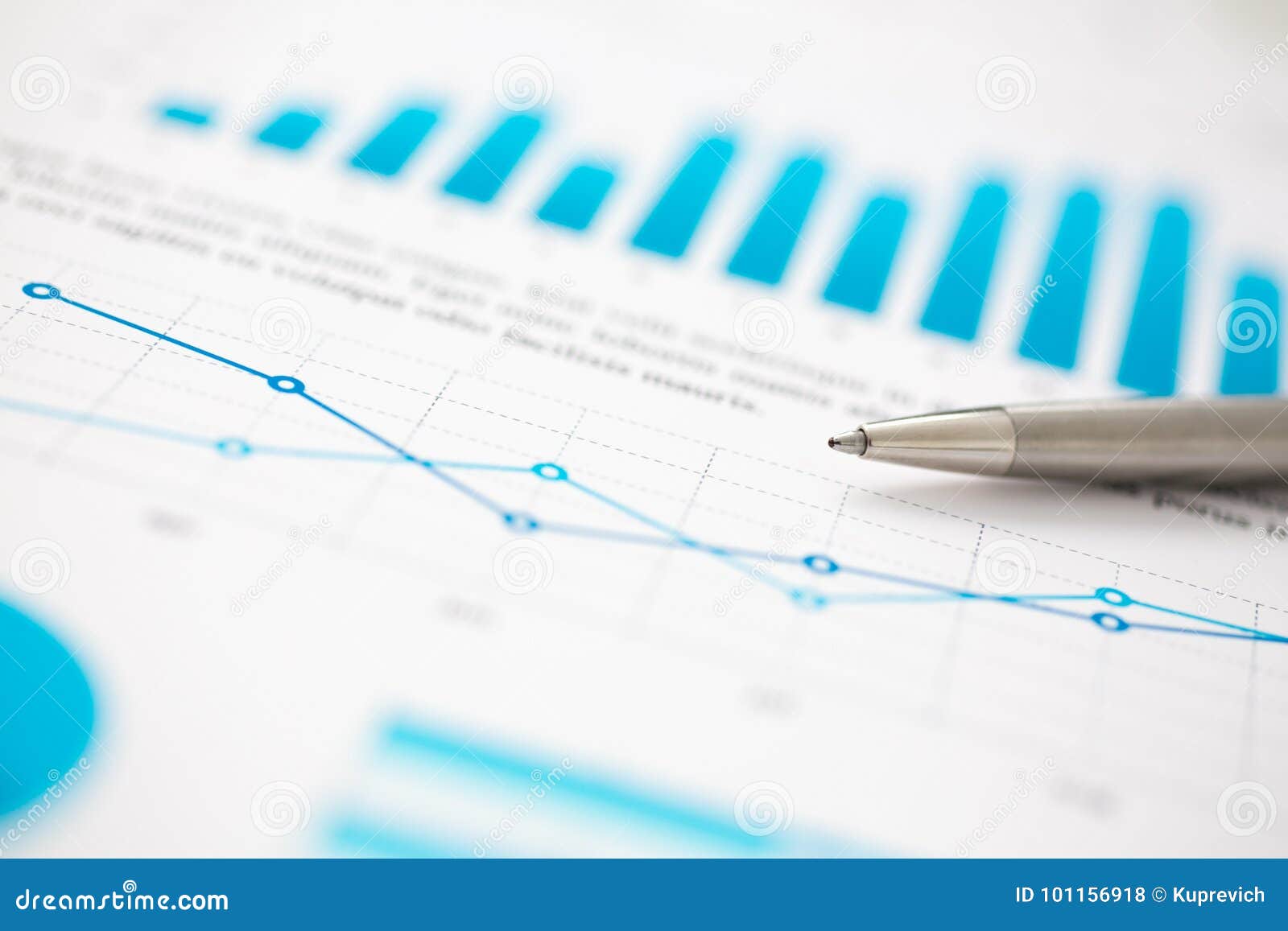 financial statistics documents ball pen infographics at office table