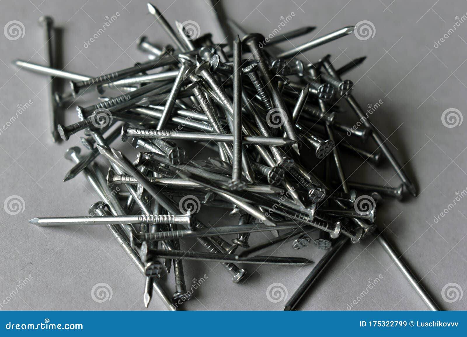 A Bunch Of Small Iron Nails On A White Background Stock Image - Image ...