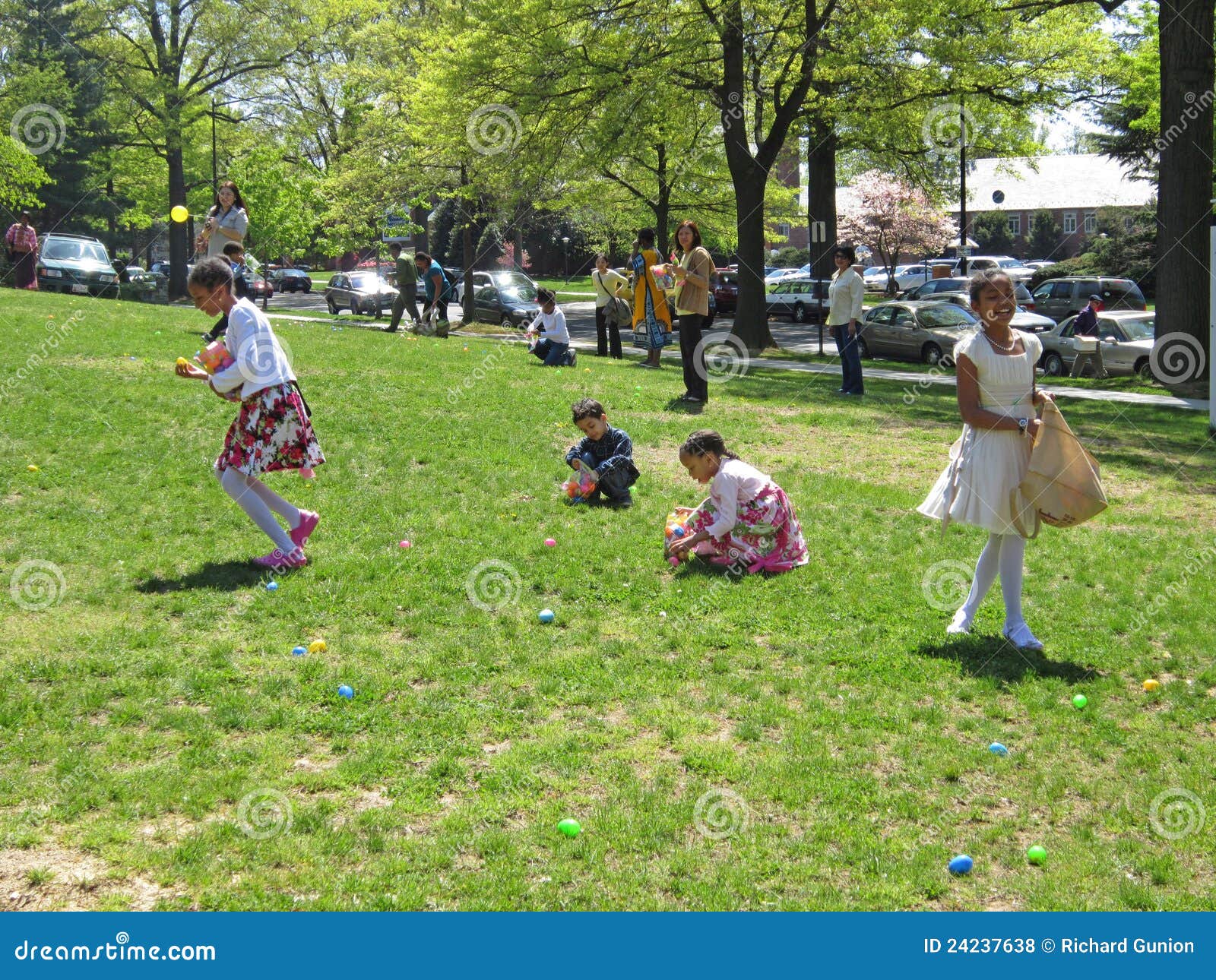 Finding the Easter Eggs editorial stock photo. Image of green 24237638