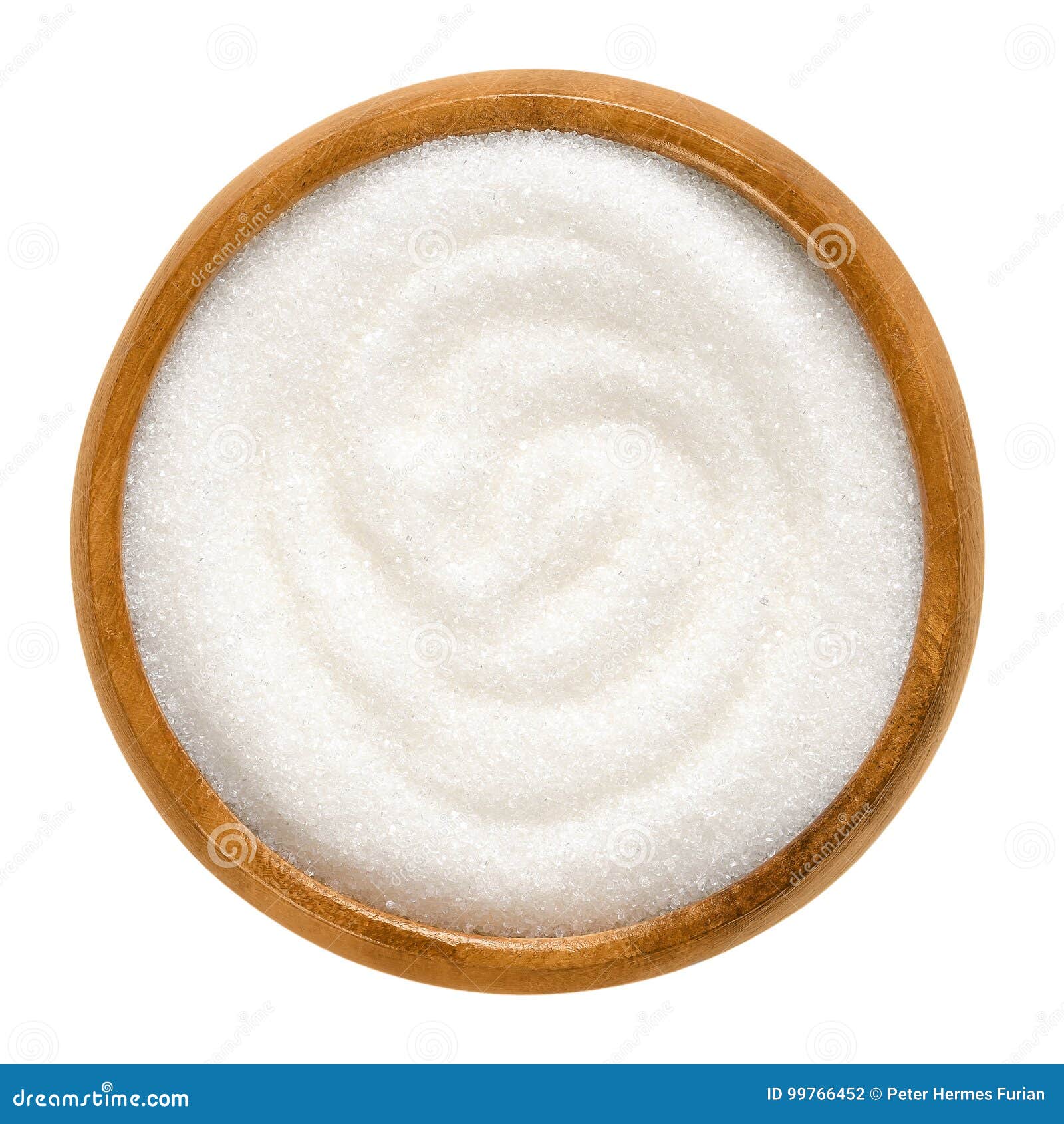 fine granulated white sugar in wooden bowl over white
