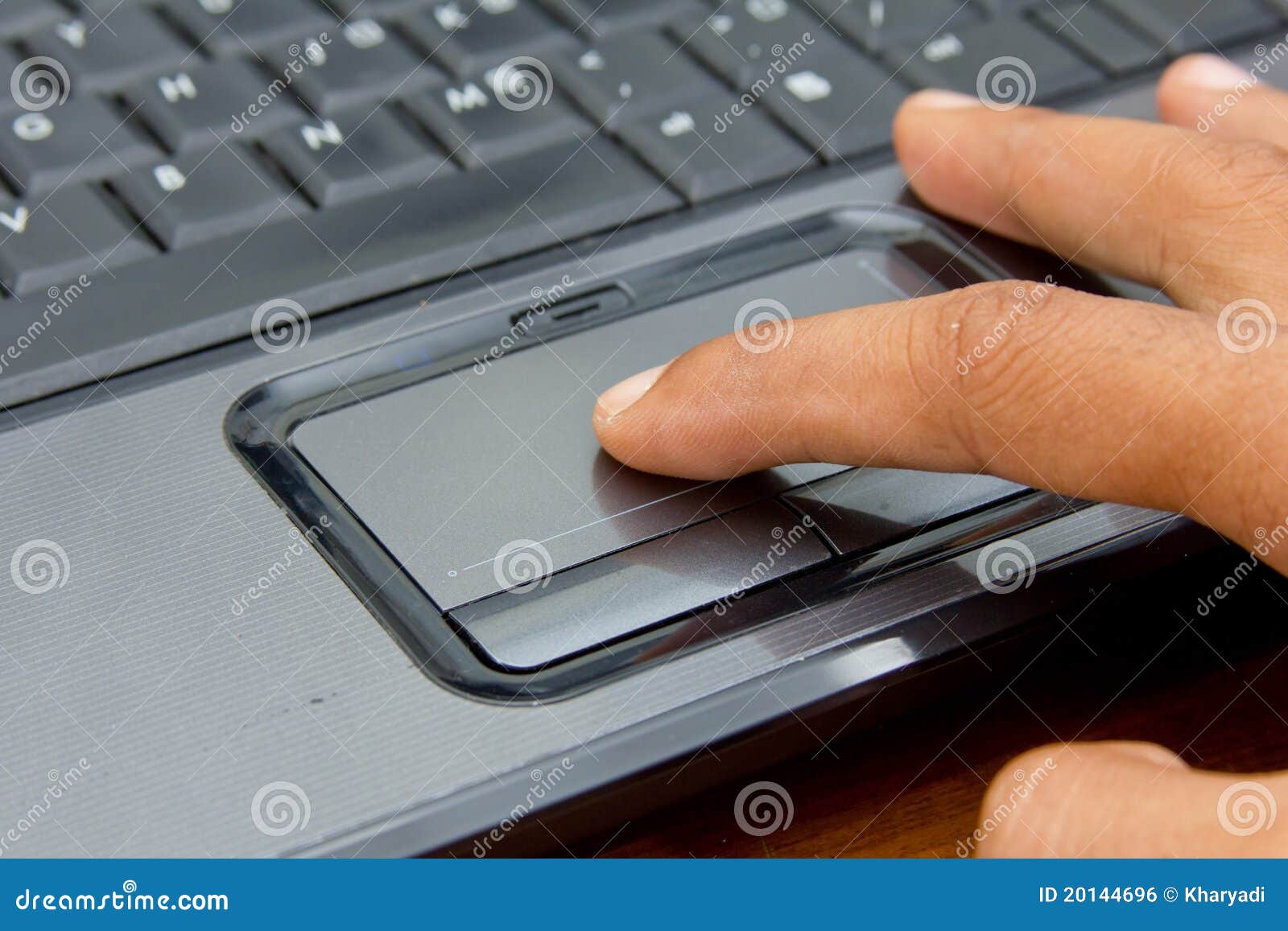 finger on notebook touchpad.