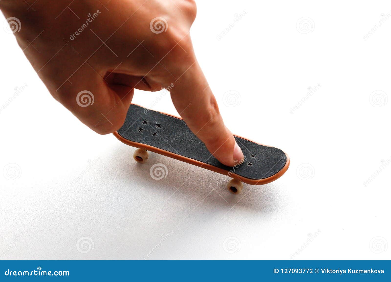 Fingerboard. a Small Skateboard and a Hand. Close Up. Isolated on White ...