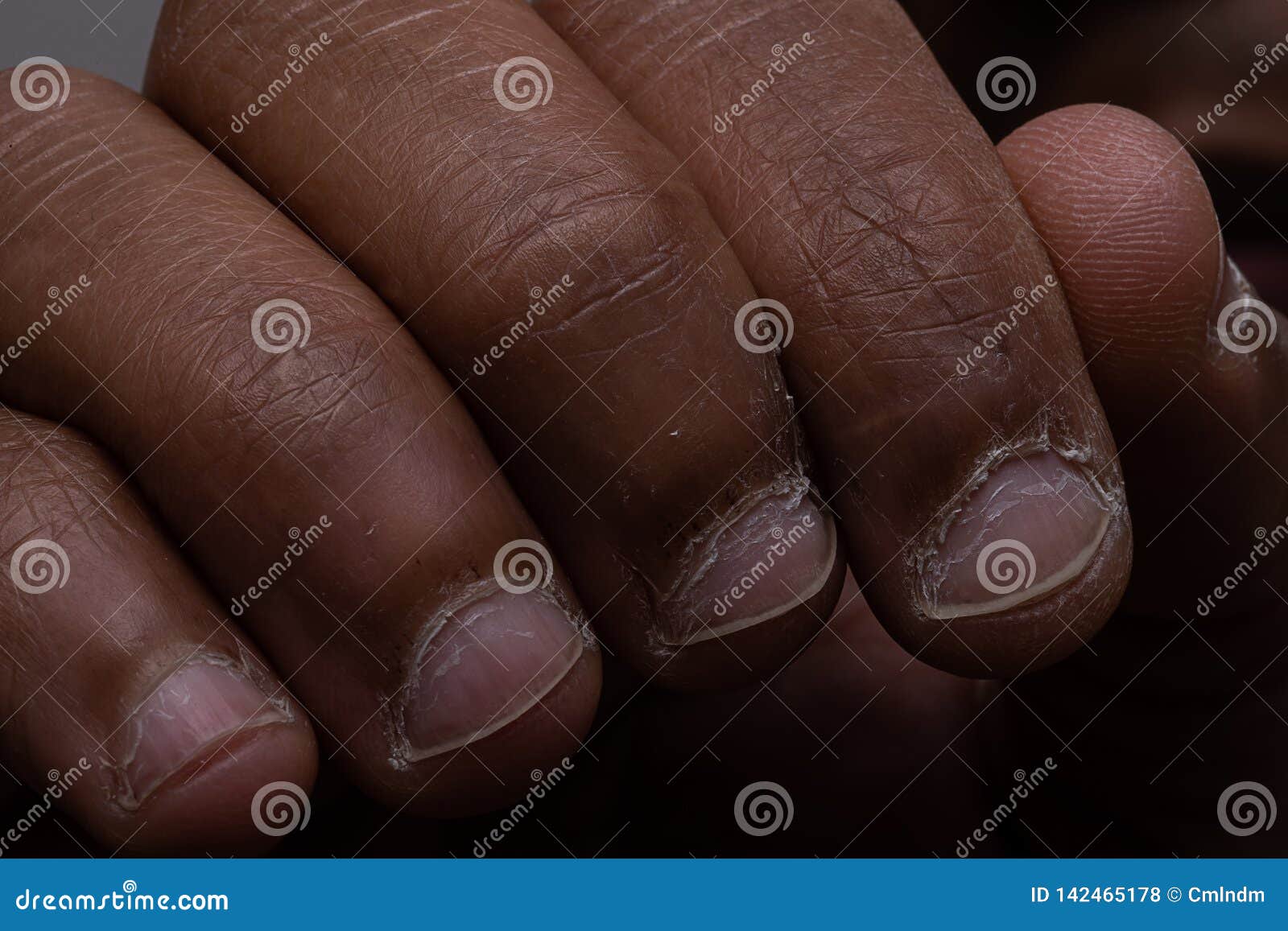 Premium Photo | The nails on the fingers of a womans hand painted in blue,  red, yellow, purple and black lacquer