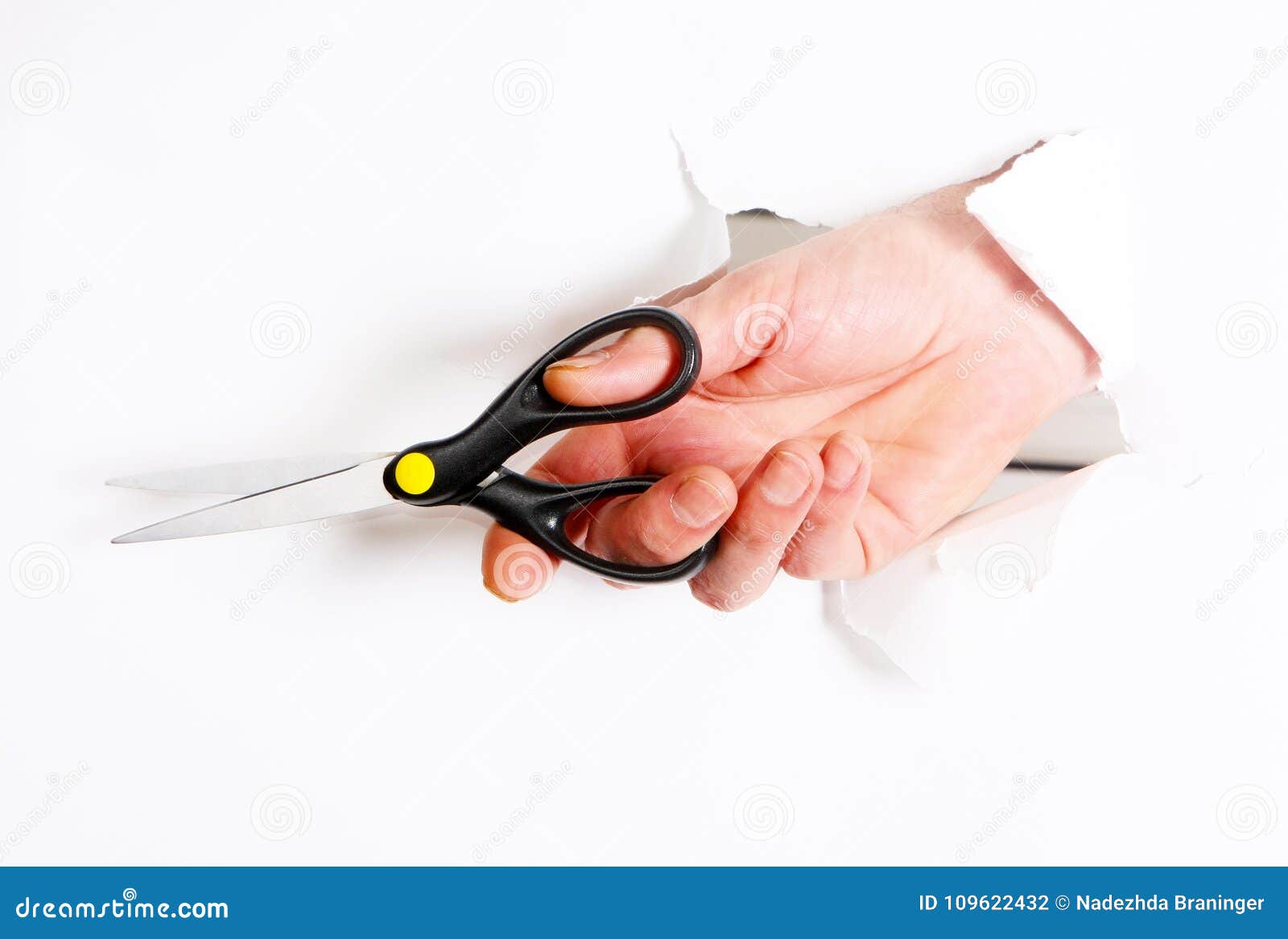 Fingers Cut with Scissors through a Hole on a White Background. Stock Photo Image of black