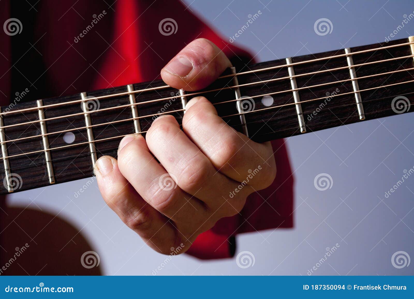 Fingers of a Guitar Player Playing Acoustic Guitar Stock Photo Image