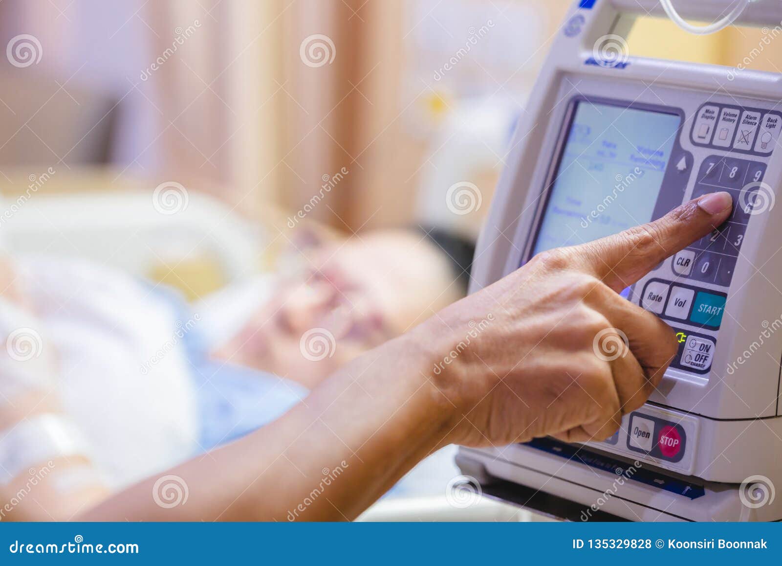 fingers press control panel for adjust infusion pumps with blurry patient