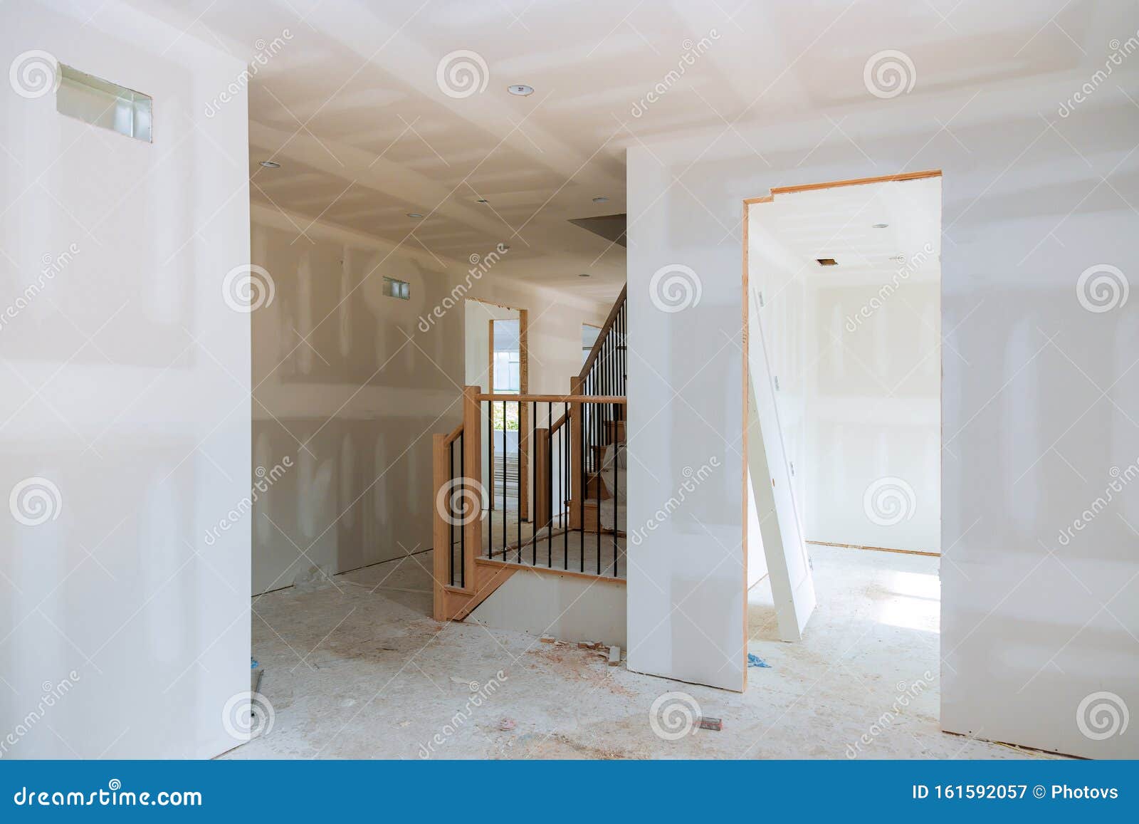 finishing putty in the room walls plasterboards with room under construction