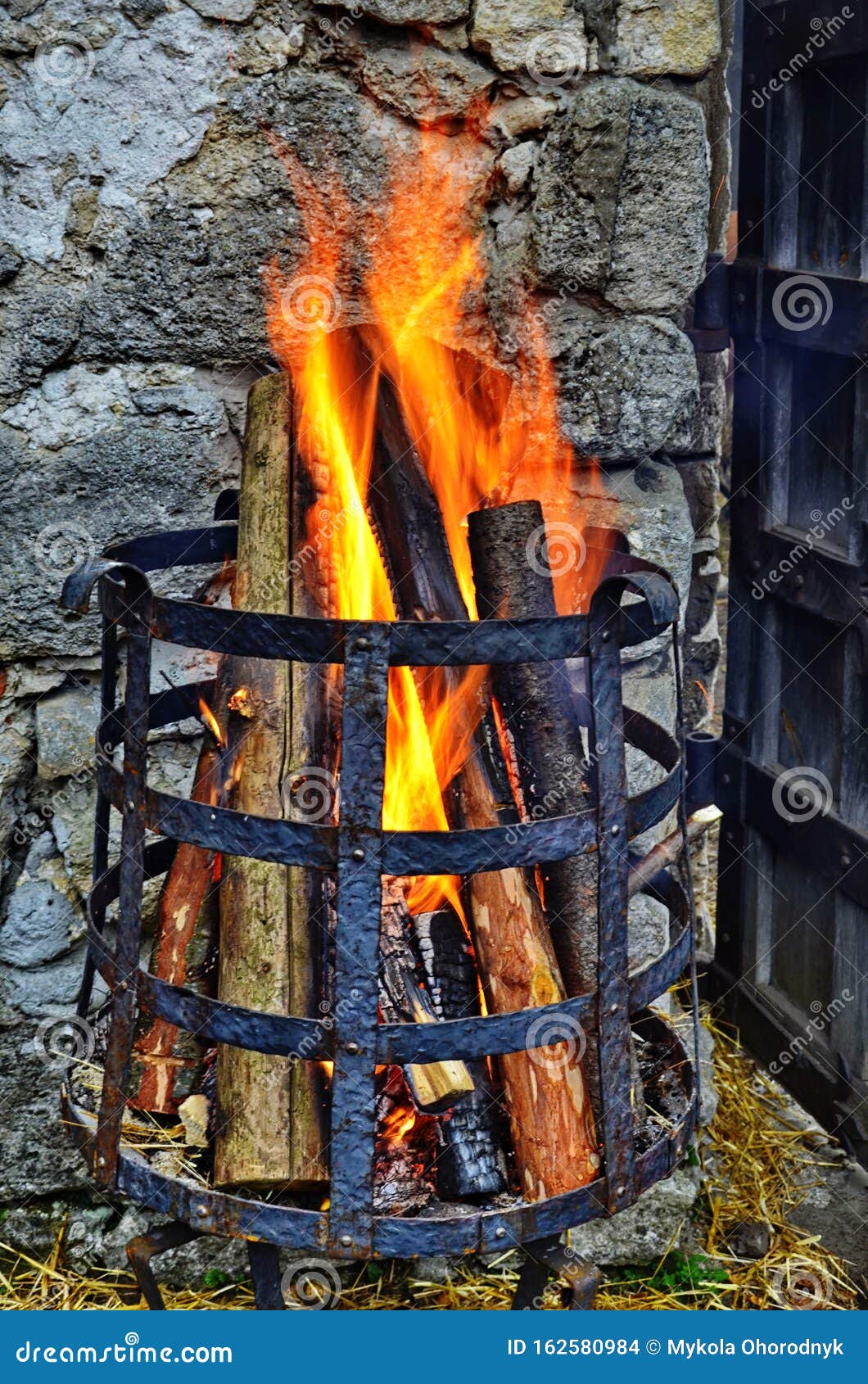 Fire in a fire basket stock photo. Image of blaze, arts 162580984