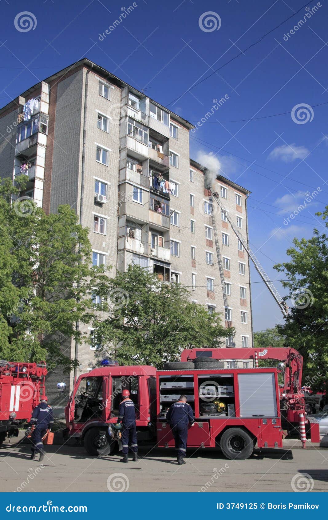Fire-brigade extinguish a fire in apartment house. Fire-brigade extinguish a fire in a high-rise apartment