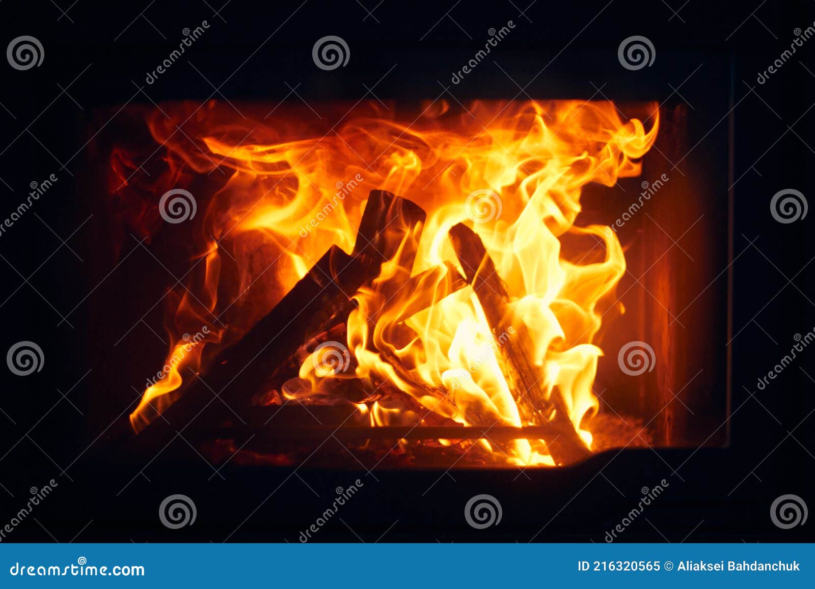 A Fire Burns in a Fireplace, Fire To Keep Warm. Logs Burning in a