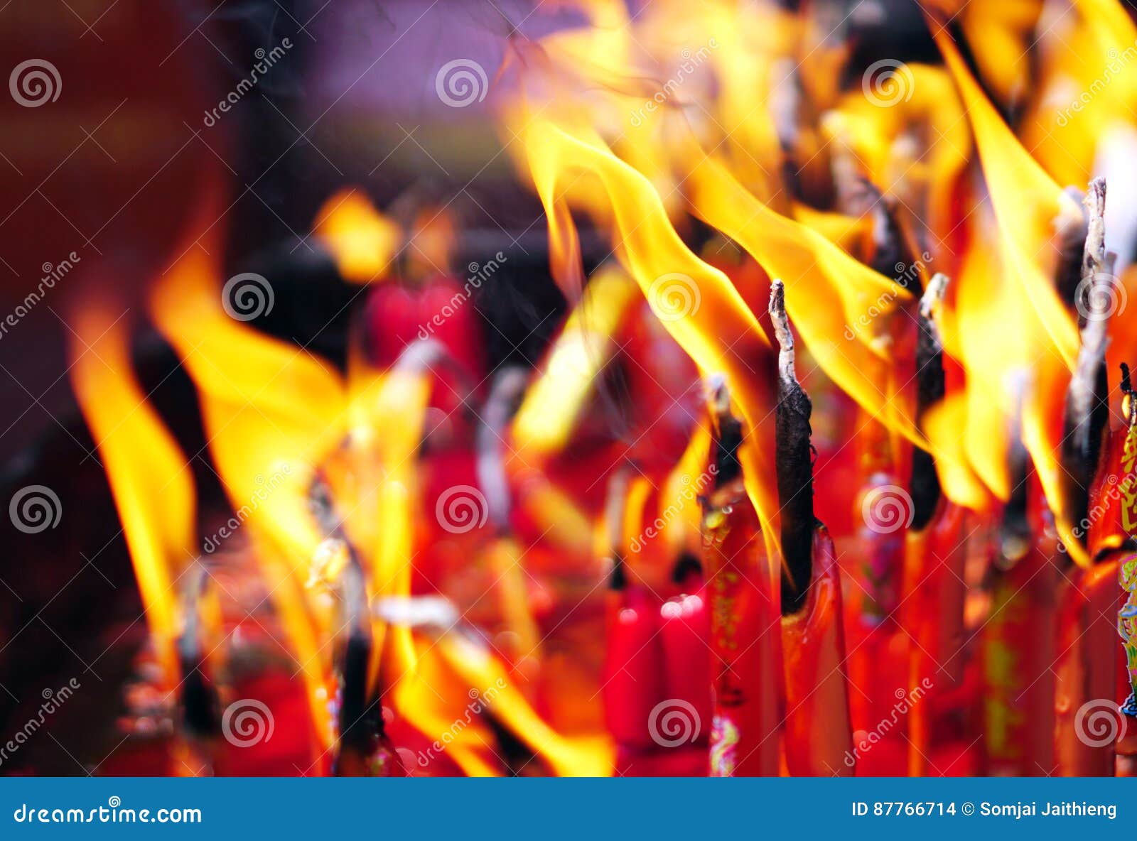 Fire on Candles after Buddhist Praying in the Temple Stock Photo