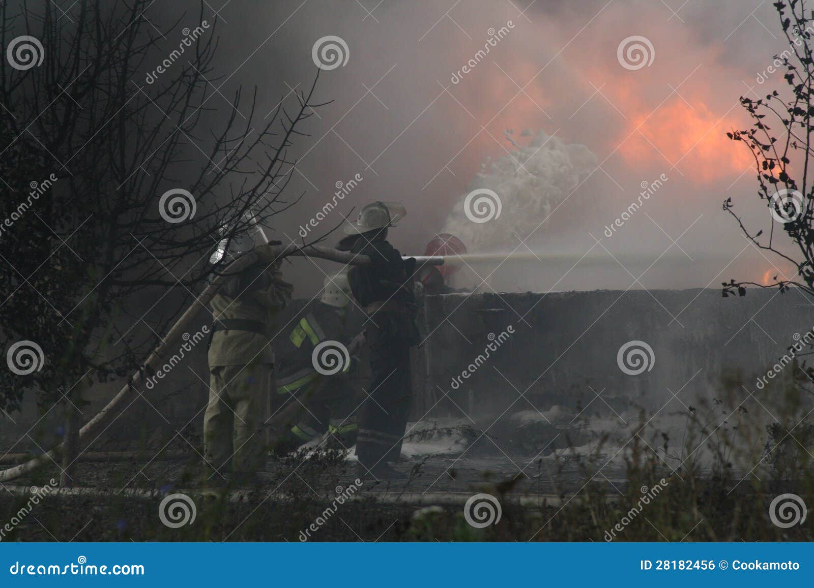 Fire Department in Action during Burning Warehouses with Plastic
