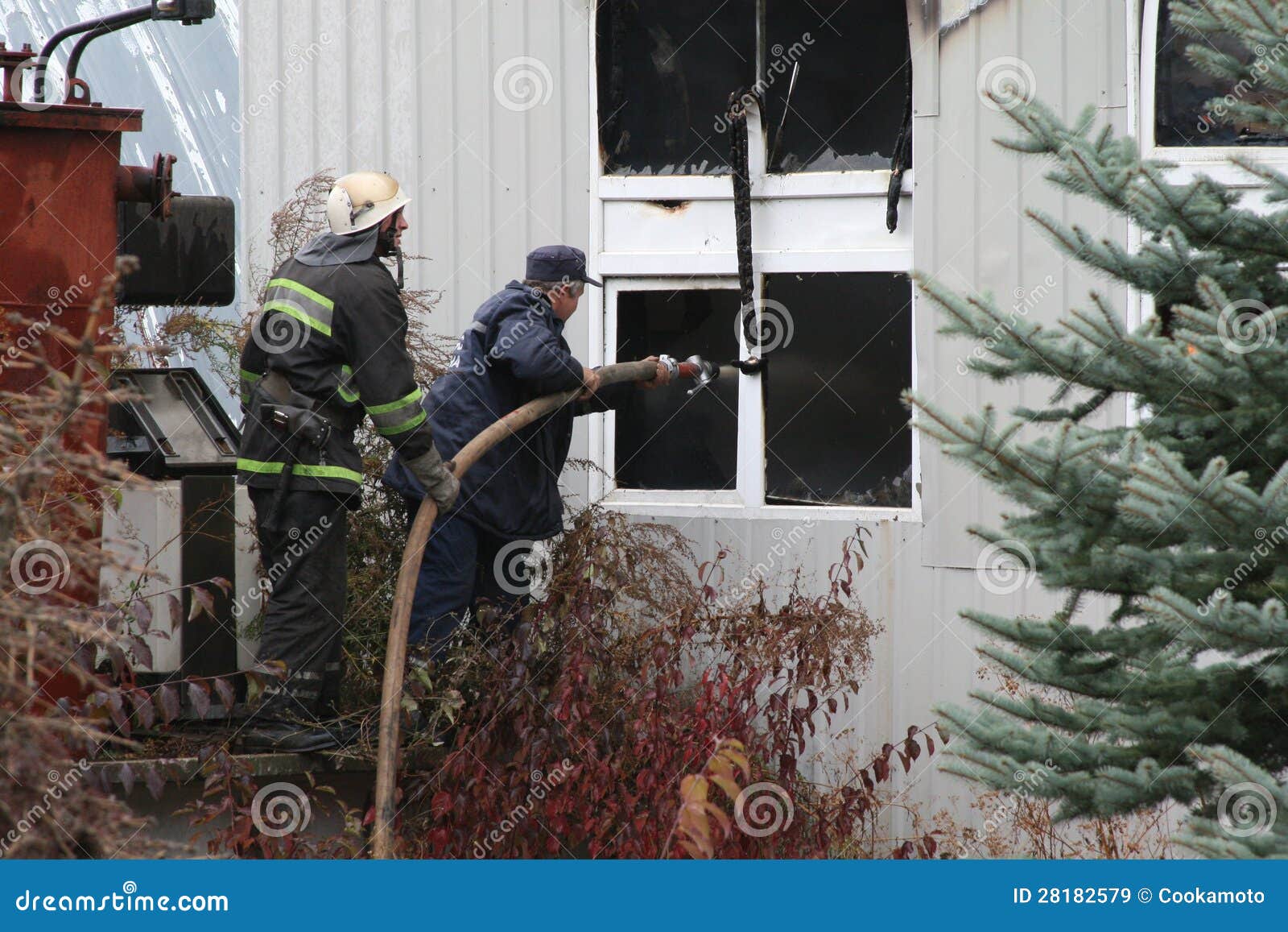 Fire Department in Action during Burning Warehouses with Plastic