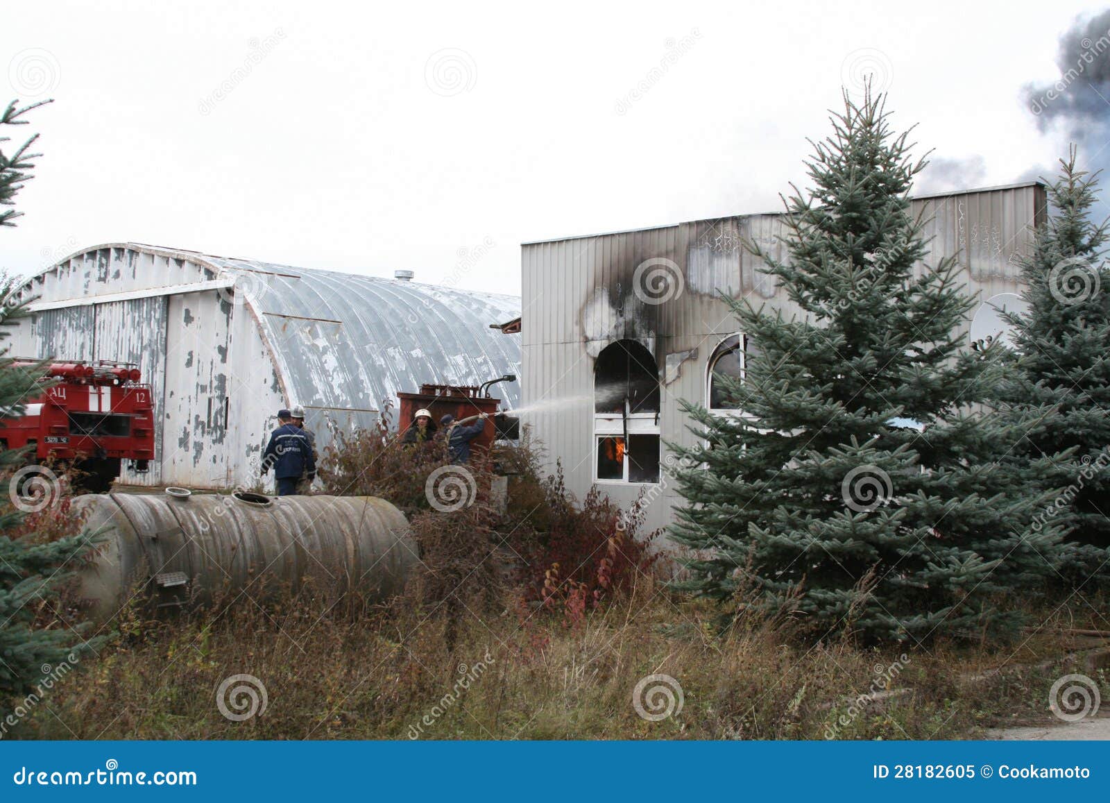 Fire Department in Action during Burning Warehouses with Plastic
