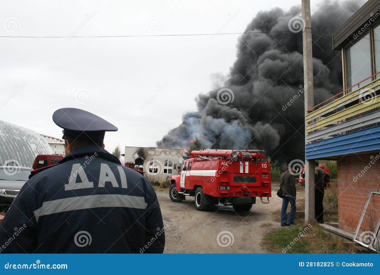 Fire Department in Action during Burning Warehouses with Plastic