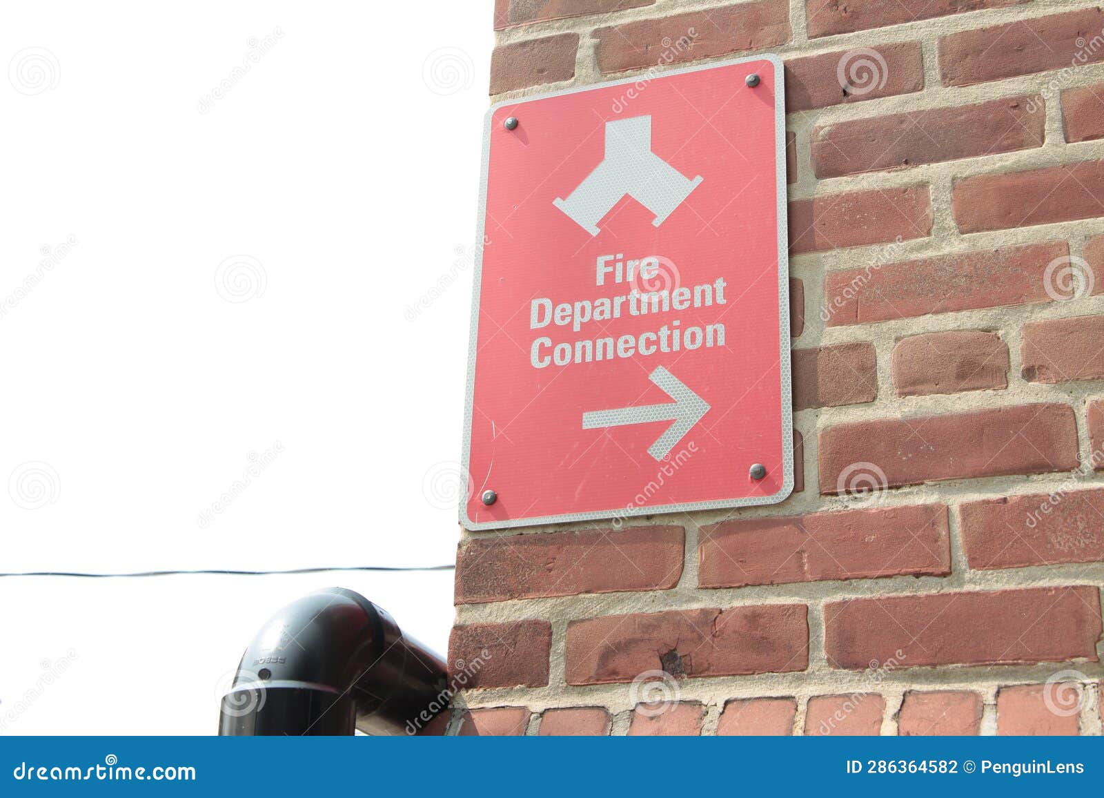 Fire Department Connection Caption Writing Text Sign on Red Brick