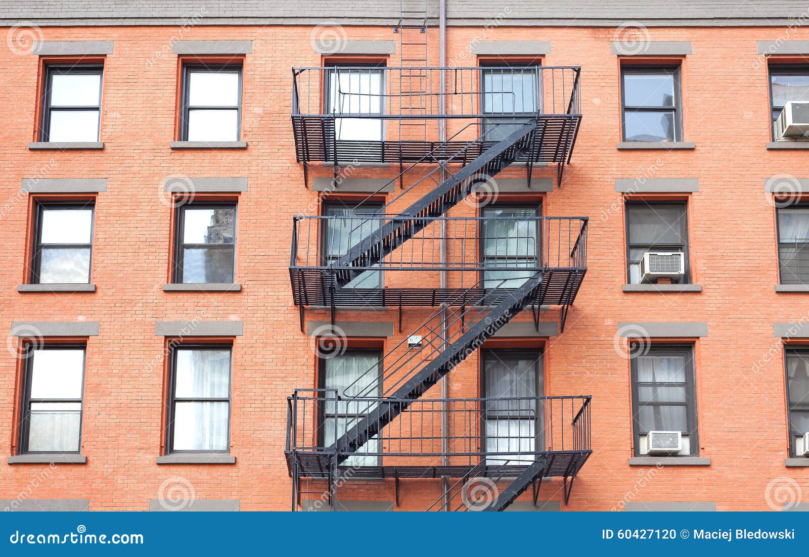 Fire Escape Ladders, Brick Building in New York. Stock Photo Image of