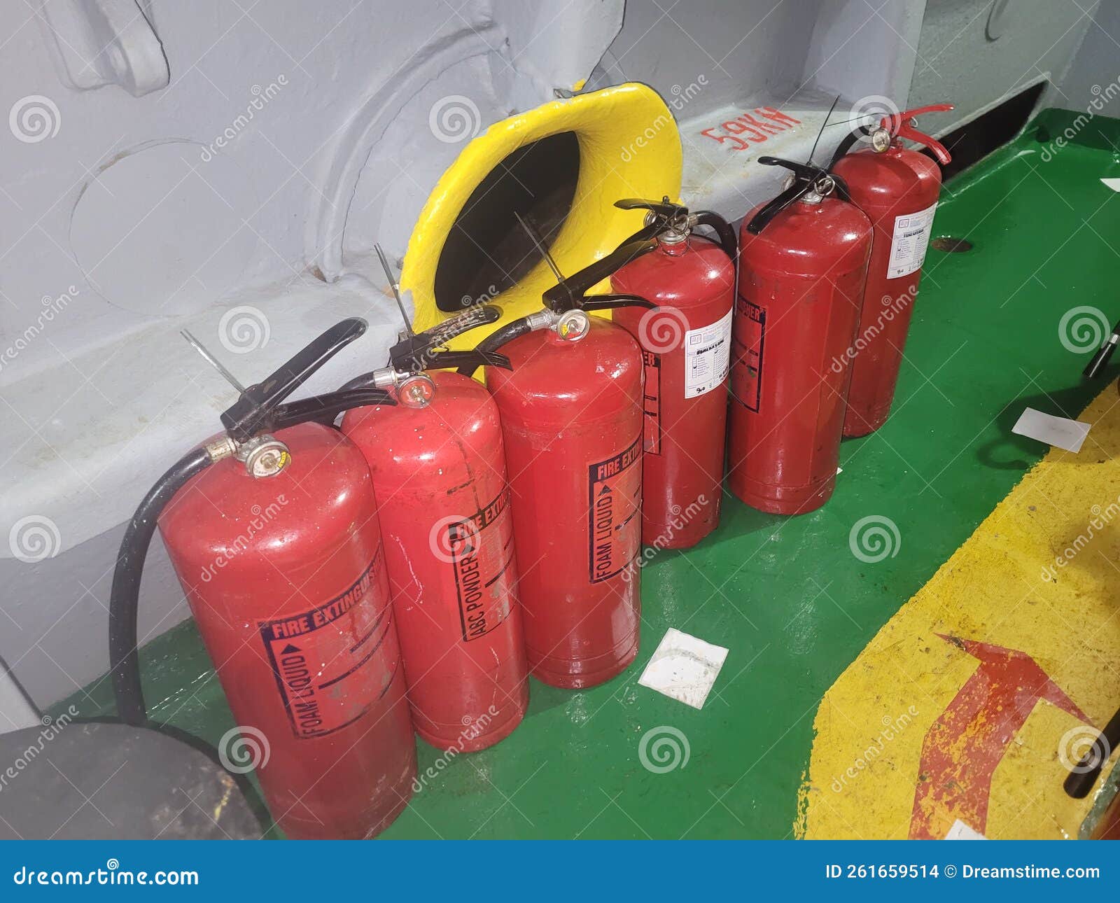 Fire extinguisher on board stock photo. Image of board 261659514