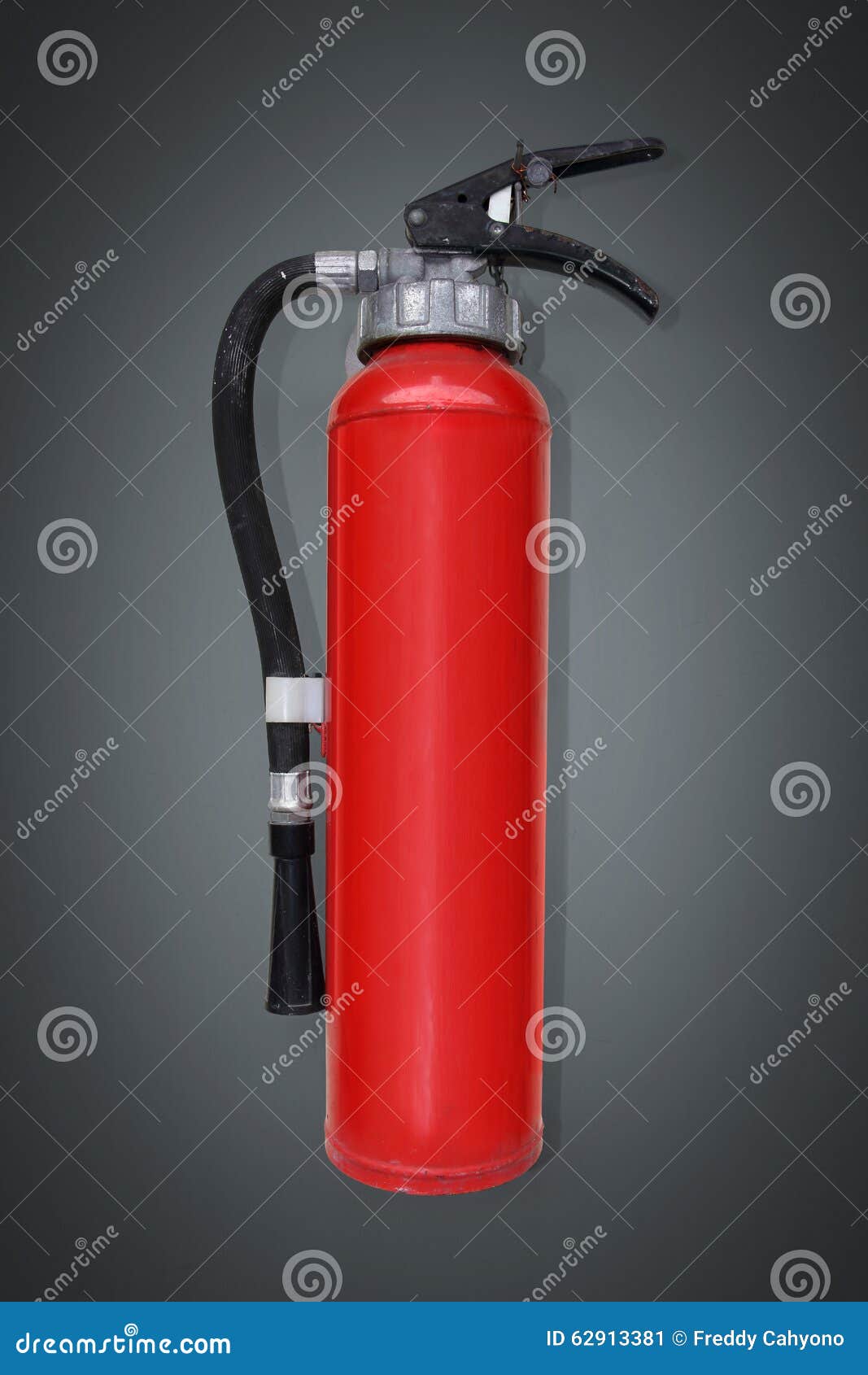 Fire extinguisher on grey stock image. Image of extinguisher 62913381