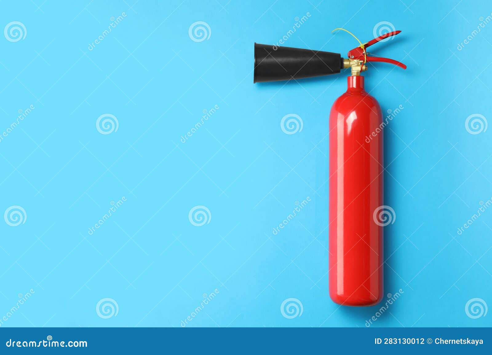 Fire Extinguisher on Light Blue Background, Top View. Space for Text