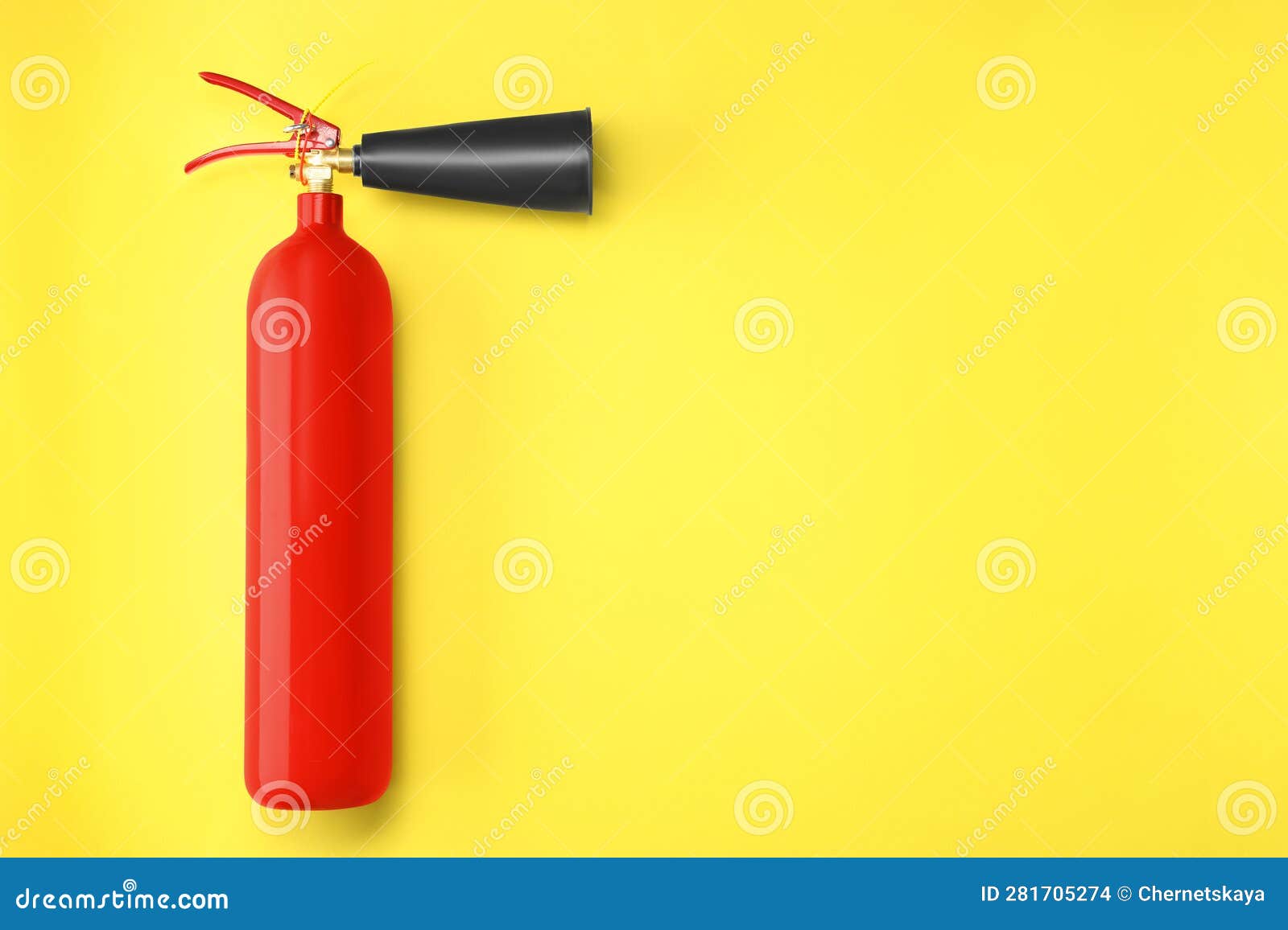 Fire Extinguisher on Yellow Background, Top View. Space for Text Stock
