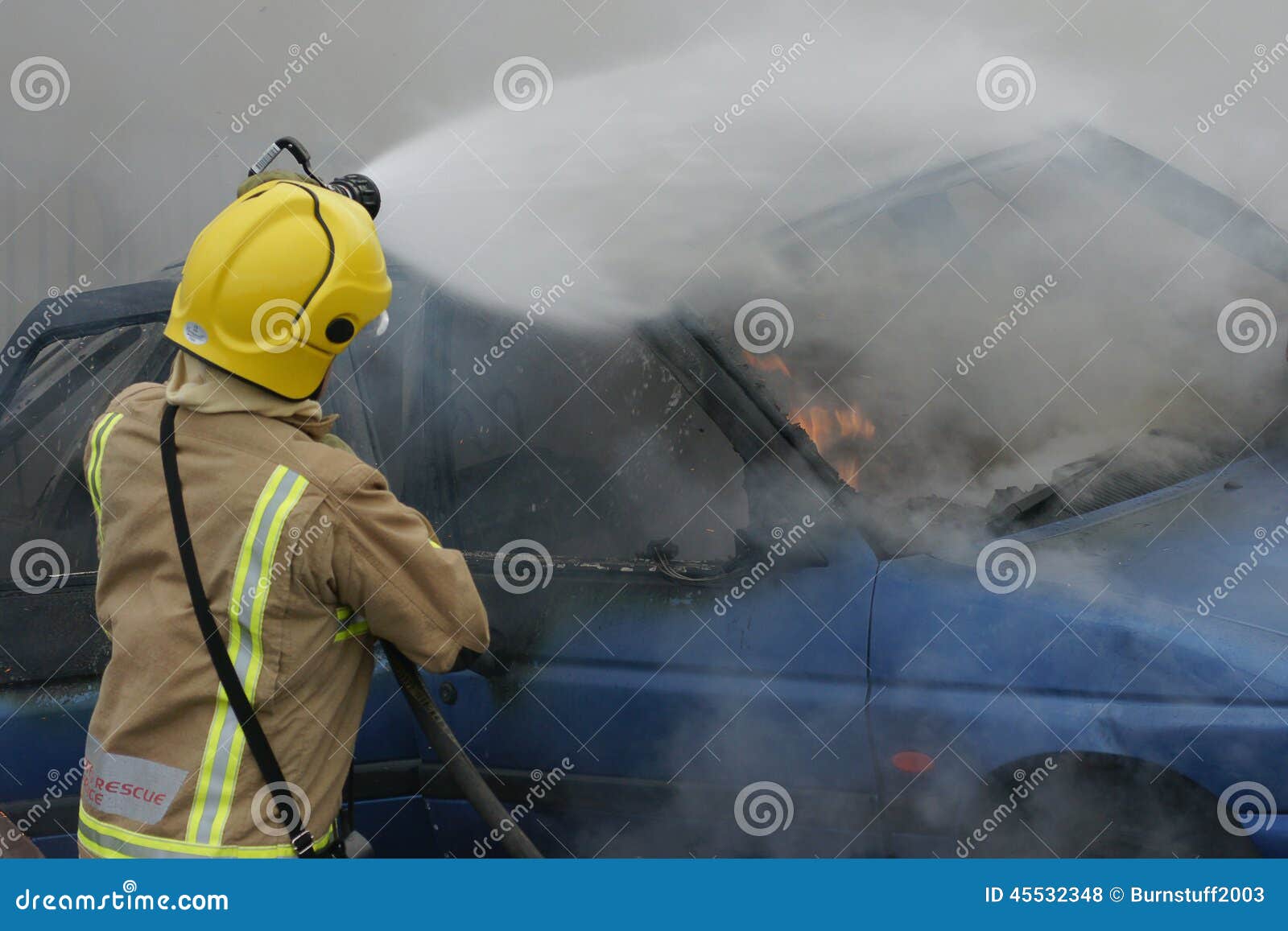 Fire fighter at car fire stock photo. Image of damage 45532348