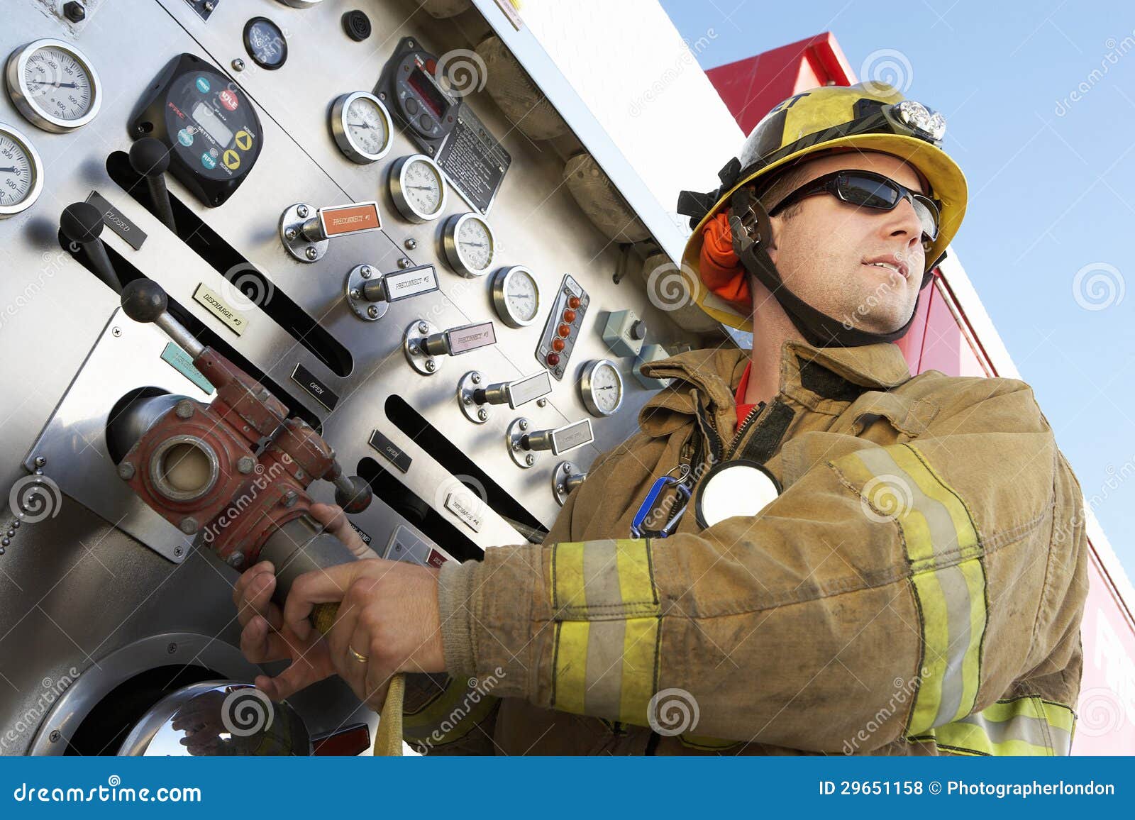 fire fighter holding hose