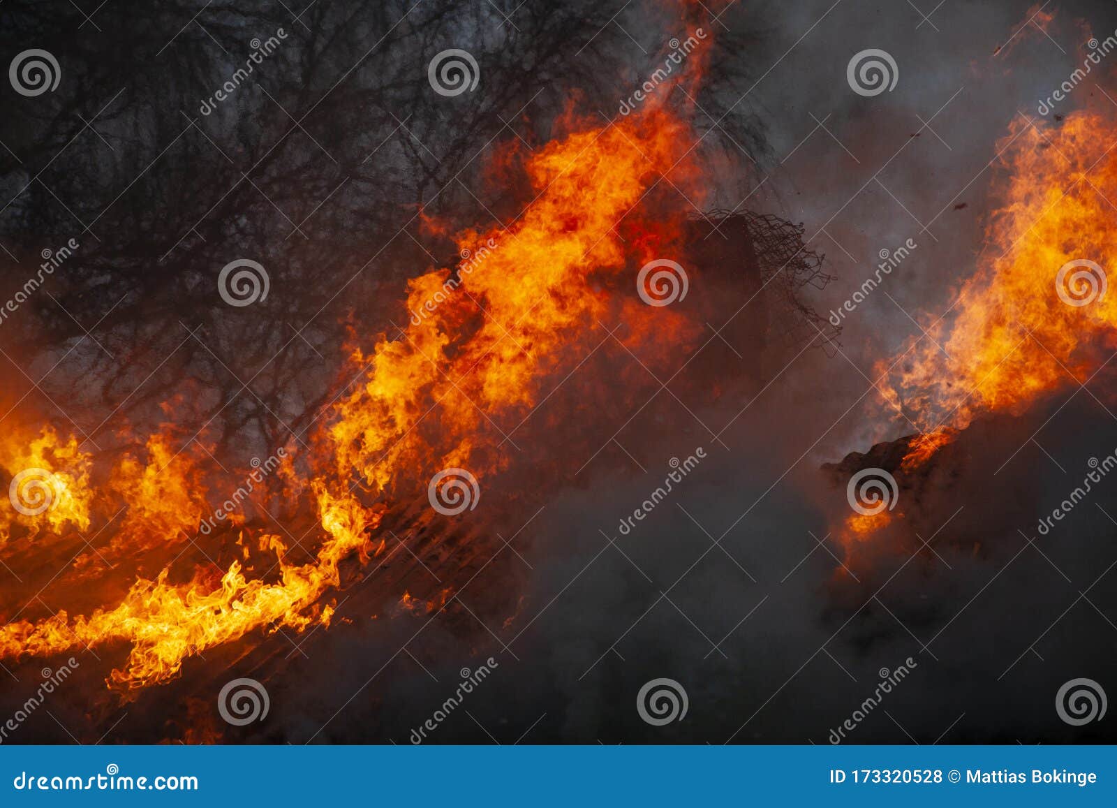 burning house and fire fighters