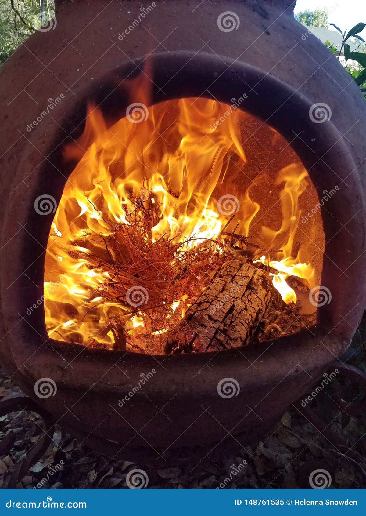 fire and flames inside clay chimenea