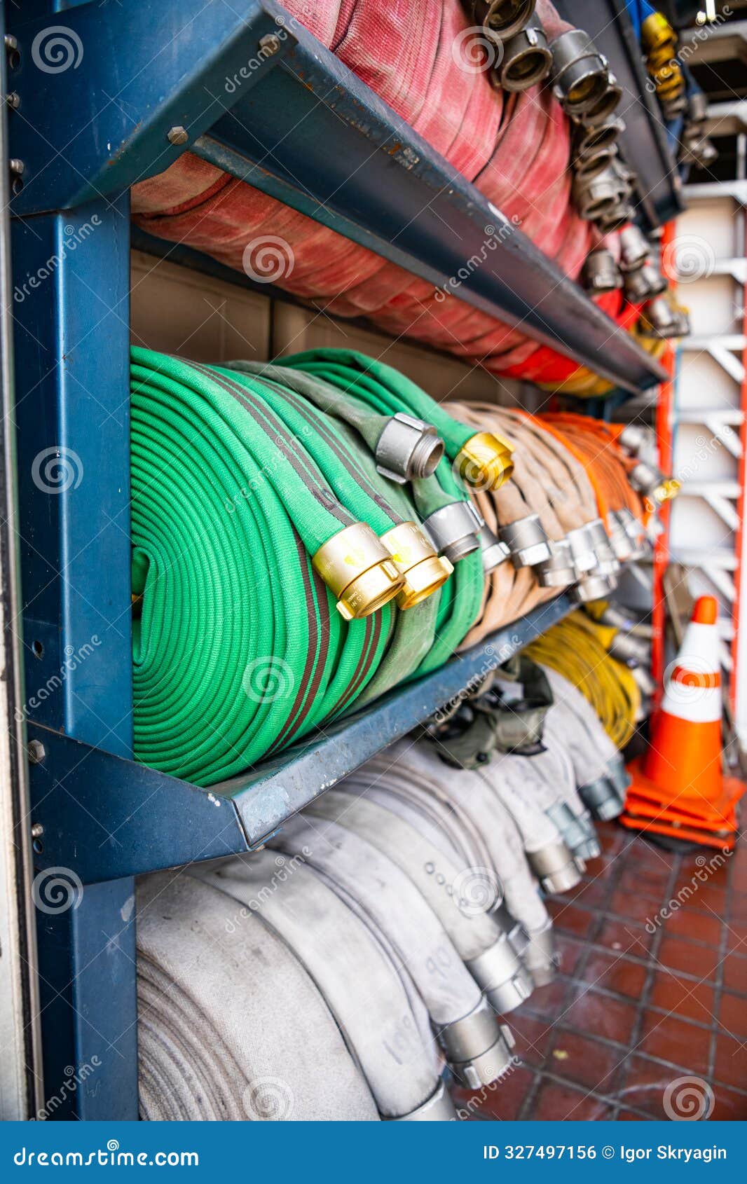 Fire Hoses of Different Colors are Stacked in Rows on a Fire Rack Stock Photo - Image of fire ...