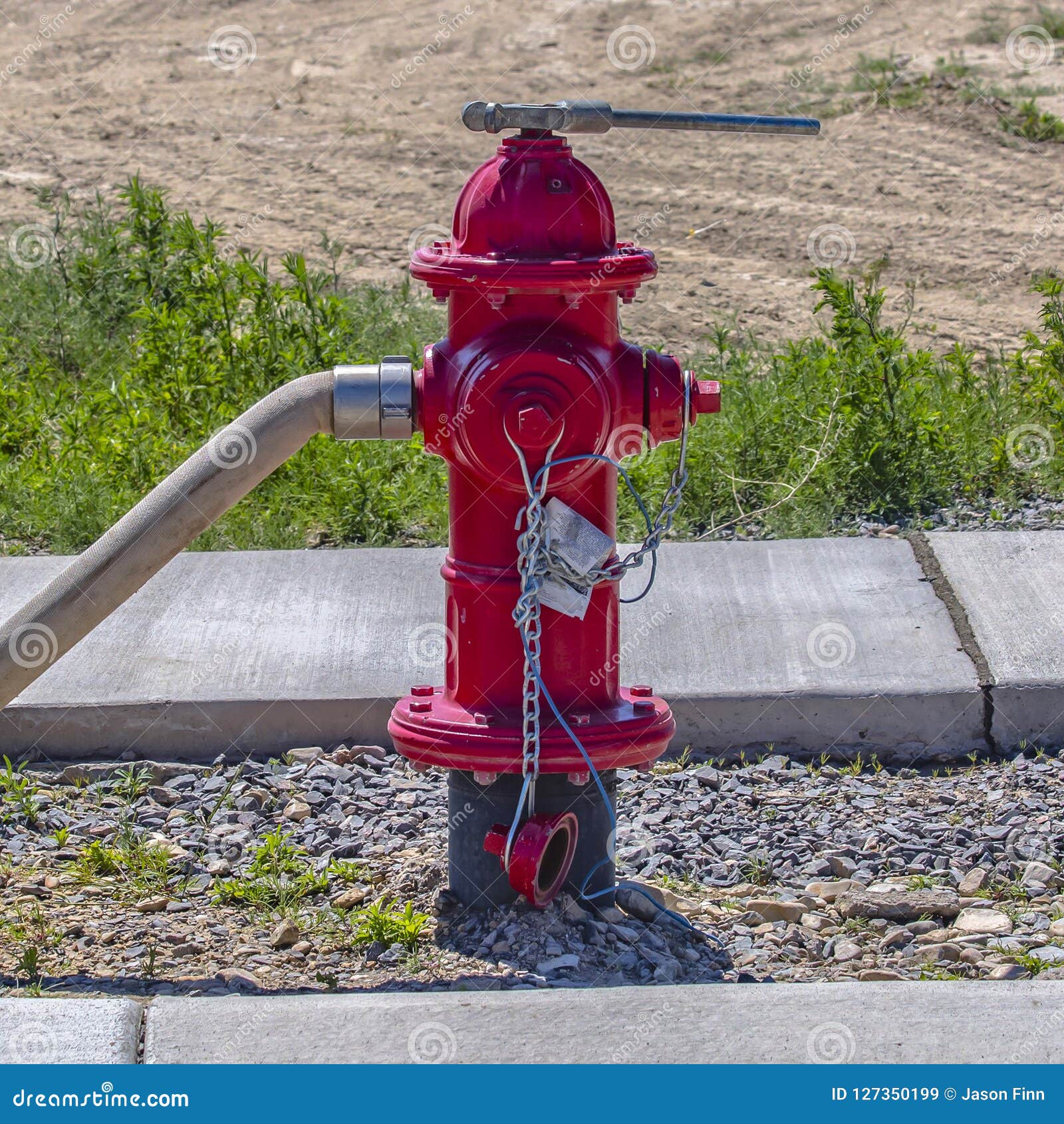 Fire Hydrant with an Affixed Hose and Wrench Stock Image Image of