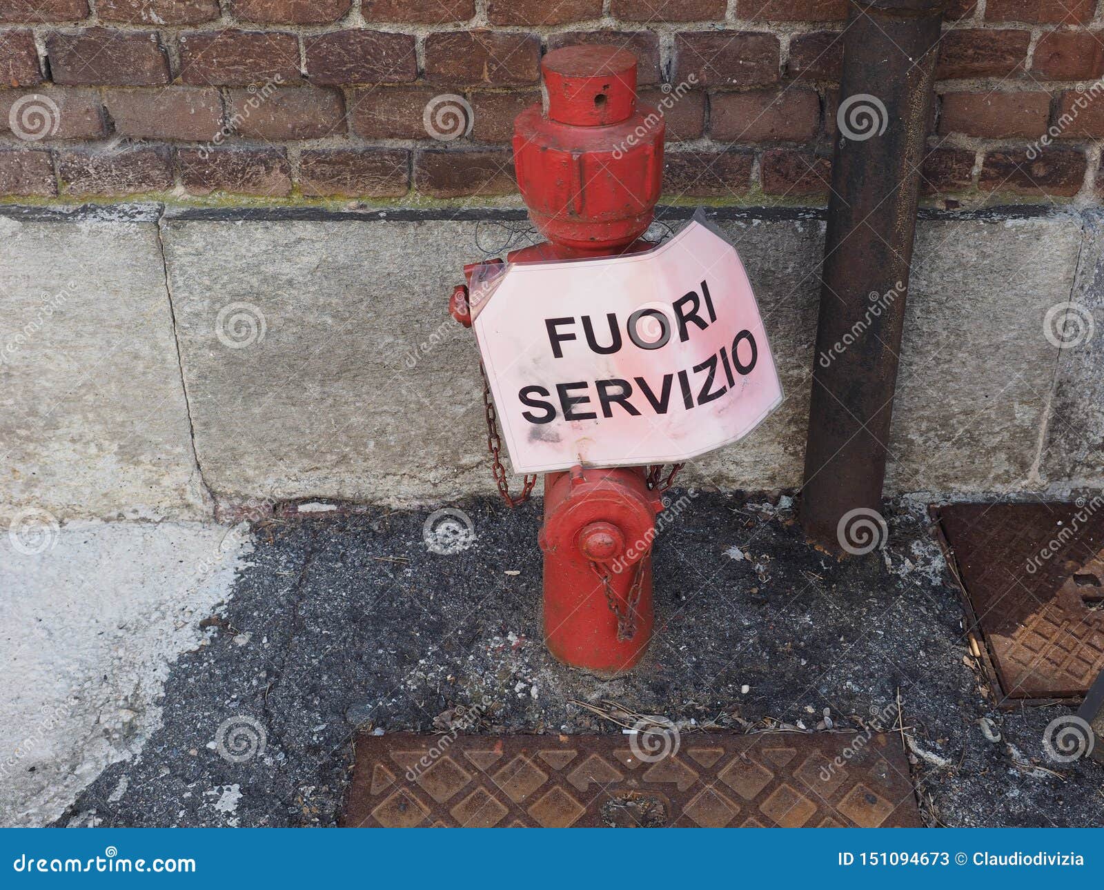 fire hydrant with fuori servizio (out of order) sign