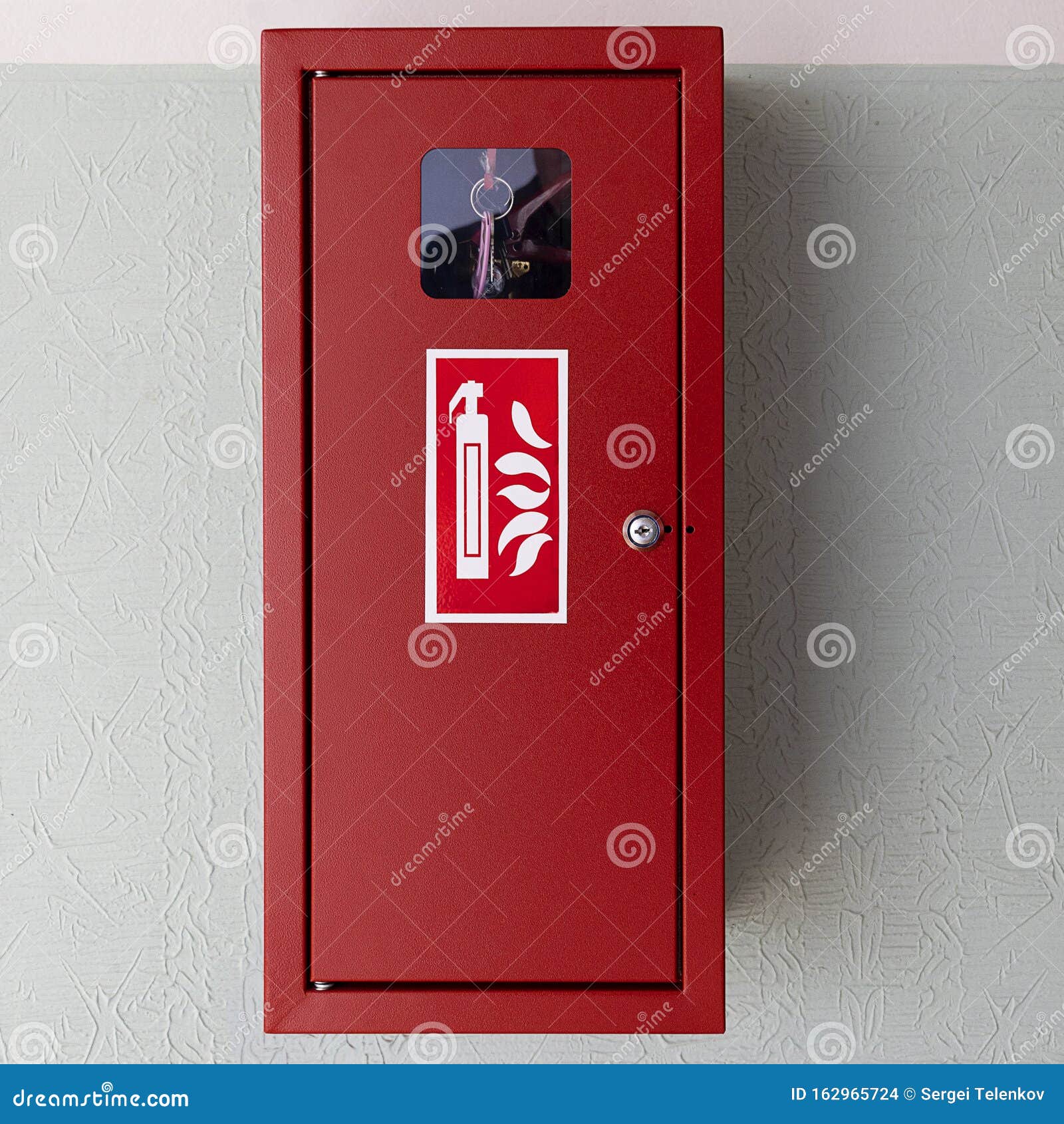 Fire Safety Equipment in a Red Box on the Wall. Fire Hoses are Packed