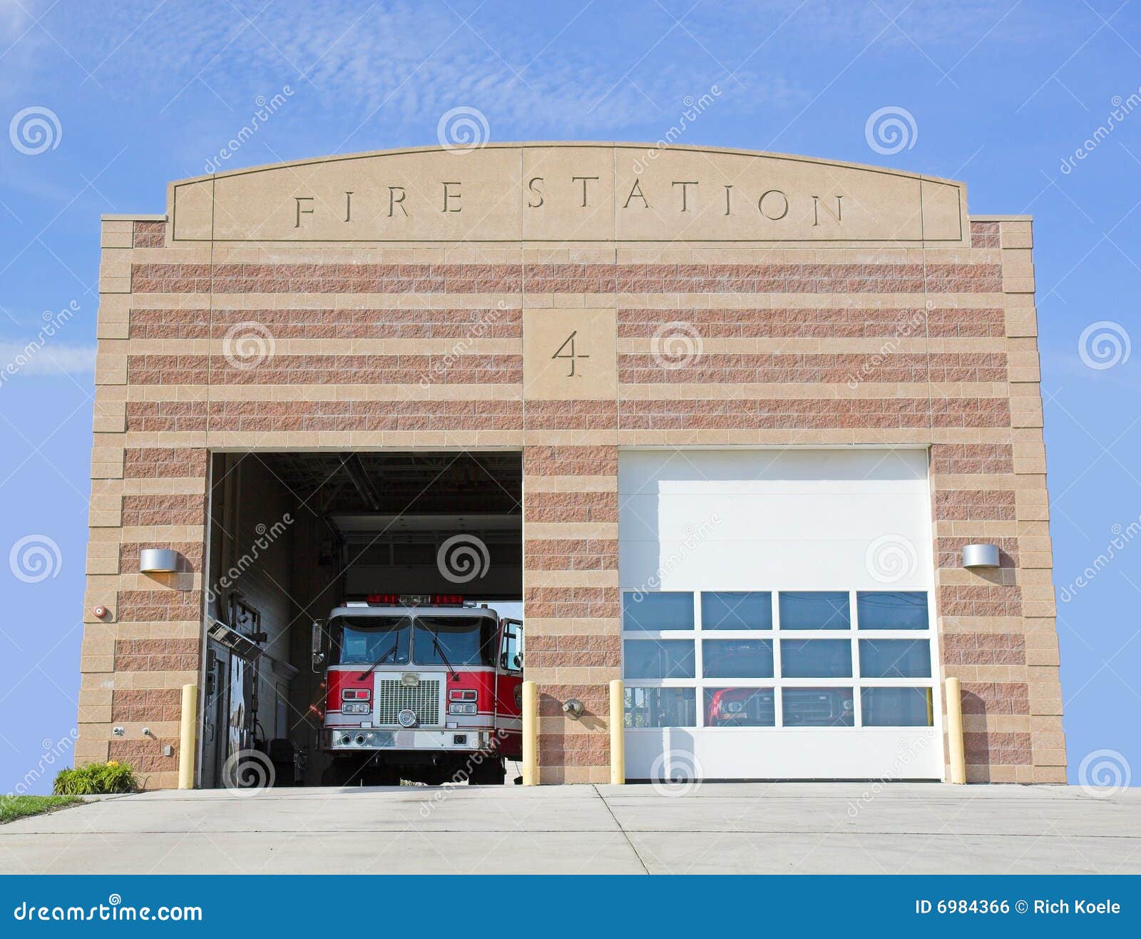 A fire station with fire truck inside