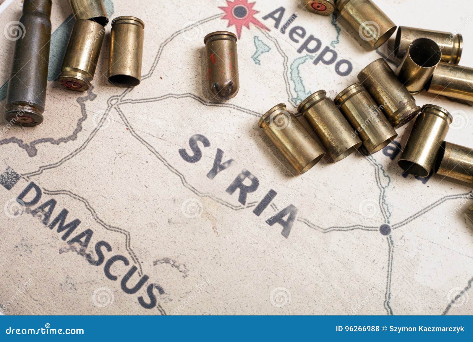 the fired cases and bullets from rifle. background view on section area of aleppo, syria.